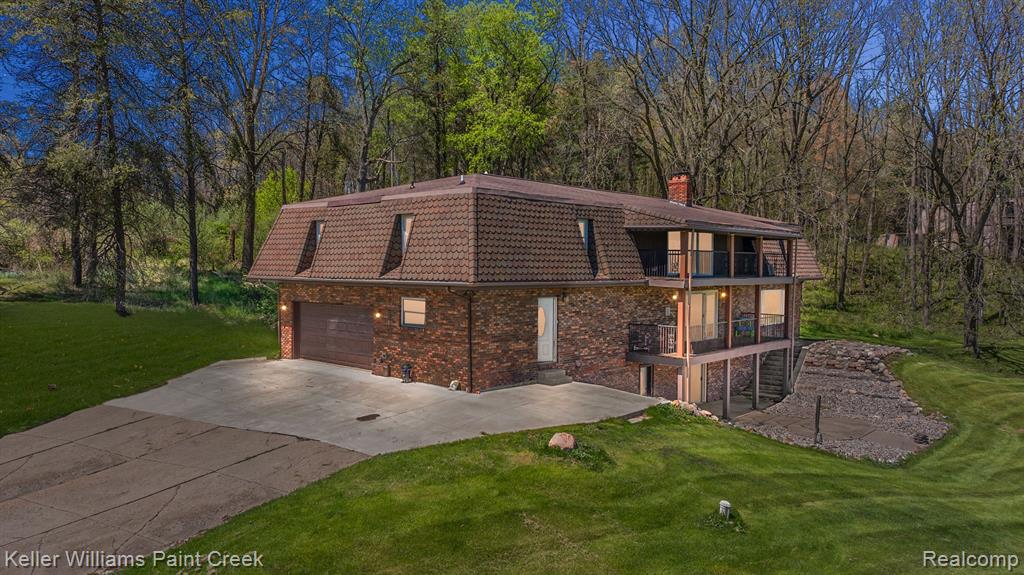 Welcome to 5060 Pratt Road, a stunning lakeside retreat listed by Evan Bassy, set on 7.38 private acres. This spacious home features 5 large upstairs bedrooms, including a luxurious primary suite with balcony access, a massive 10x10 walk-in shower, jetted tub, and dual vanities. The open-concept main floor offers a gourmet kitchen with granite counters and custom cabinetry, flowing into the living and dining areas with a double-sided fireplace. A walk-out basement provides extra living space, ideal for an in-law suite or guest area, with easy access to the outdoors. Enjoy your own private pond, abundant wildlife, and plenty of space for future additions like a workshop or she-shed. All just minutes from Hadley and a short drive to Lapeer, Davison, Ortonville, and Oxford. Dont miss out!