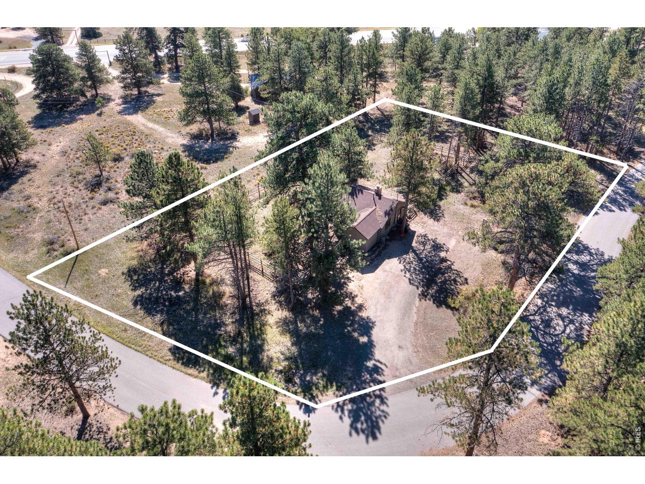 Your mountain escape AND a cabin that earns its keep. Tucked under Ponderosa Pines on a quiet 0.6-acre lot, this fully renovated, fully furnished cabin is ready for two lives at once: your weekend getaways, and a steady stream of short-term rental guests when you're not there. Location is everything here: just minutes to downtown Estes Park's shops and restaurants, a quick trip to Lake Estes for paddleboarding, biking, or a lakeside walk, and a short drive to the entrance of Rocky Mountain National Park. Everything your guests (and you) come to Estes for is right around the corner. Inside, warm hardwood floors and a striking stone wood-burning fireplace set the tone. The 2021 kitchen remodel brings granite counters, new cabinetry, and stainless steel appliances. The cozy 1 bed, 1 bath layout lives bigger than its footprint, with updated electrical, plumbing, and lighting already done for you. Step outside to an east-facing deck overlooking an open meadow where elk and deer wander by, your private spot for morning coffee or evening stargazing. A partially fenced yard and large storage shed keep your gear ready for the next adventure. Already operating as a successful short-term rental, this cabin comes turnkey: furniture, linens, kitchenware, and decor included, with the license already in place and transferrable in the future. Use it for yourself when you want it, and let the bookings help cover the rest the rest of the time.