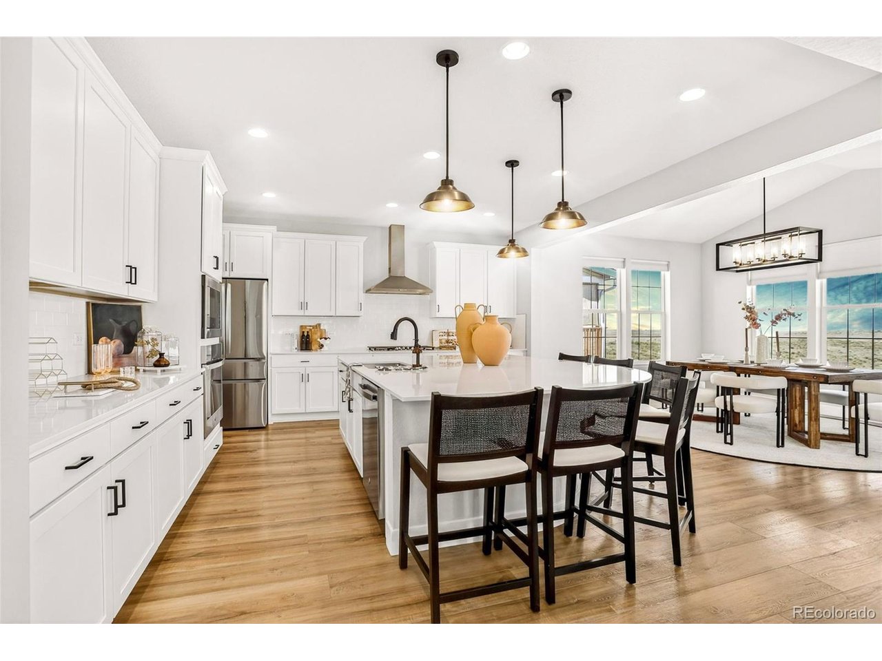 Welcome home to the Hemingway model in the highly desirable Southshore neighborhood. This beautifully designed home backs to open space and faces a charming neighborhood park, offering peaceful views and a wonderful sense of privacy. The gourmet kitchen is the heart of the home, featuring a huge center island, quartz countertops, double ovens, a gas cooktop with hood, and a spacious walk-in pantry, perfect for everyday living and entertaining. The dining area sits just off the kitchen in a bright sunroom-style space with beautiful views of the open space. The family room is warm and inviting with a fireplace and large windows that bring the outdoors in. A private main-floor study with double French doors provides the ideal work-from-home setup. Upstairs, the loft creates an additional living area perfectly situated between the bedrooms. The primary suite is spacious and serene with peaceful open space views, a large walk-in closet, and a beautifully designed five-piece bathroom featuring a double vanity, soaking tub, separate shower, and private water closet. Three additional generously sized bedrooms are conveniently located on the upper level. The fully finished walk-out basement offers incredible additional living space with a large recreation or entertaining area, a spacious bedroom, and a full bathroom, perfect for guests or multi-generational living. Step outside to the covered deck, an amazing space for relaxing or entertaining while enjoying the unobstructed views of the open space behind the home.