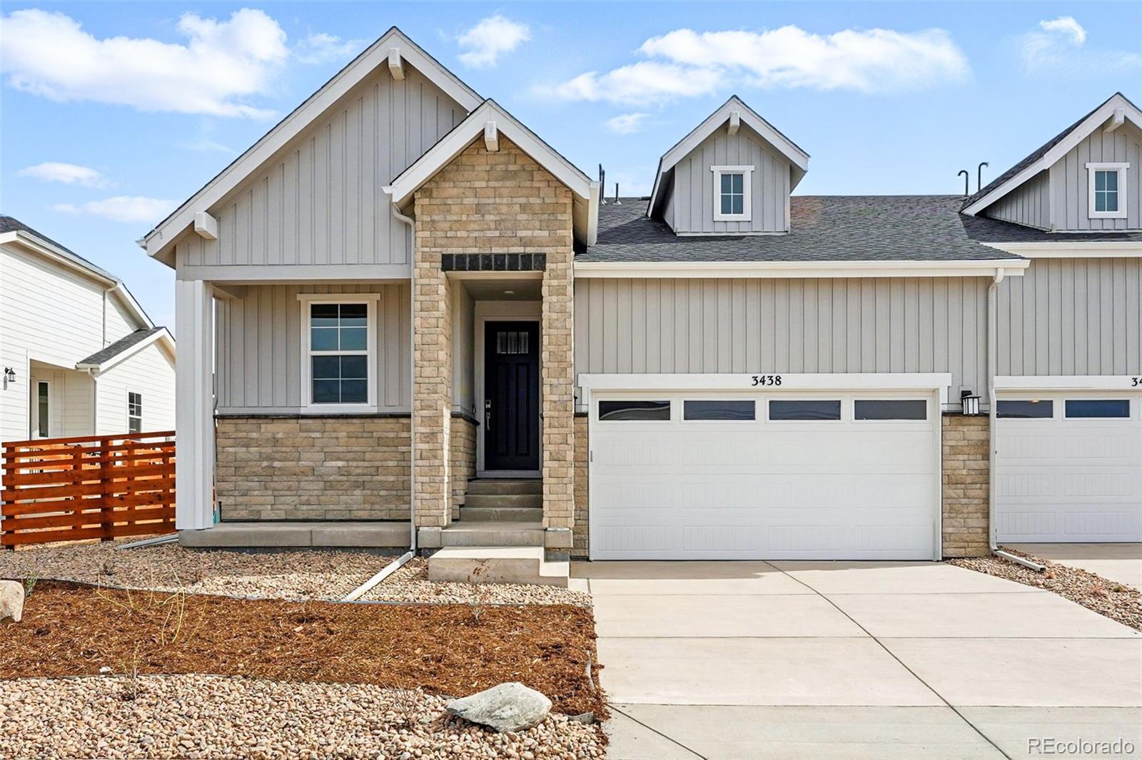 MLS#6756079 Built by Taylor Morrison, New Construction - Ready Now!  The Sand Dune floor plan at Aurora Highlands offers a stunning paired-home design that blends style and convenience. Enjoy a bright and airy kitchen, dining, and great room with abundant windows that capture the beauty of Colorado living. Your spacious primary suite is tucked at the back of the home, featuring a walk-in closet and a relaxing 4-piece bath. Designed for effortless main-floor living, this home also includes a convenient laundry room. Hosting guests or sharing your space? The secondary bedrooms and full bath are thoughtfully placed at the front, offering privacy and comfort. Structural options added include: gourmet kitchen, bedroom 3 instead of flex room, and outdoor living.