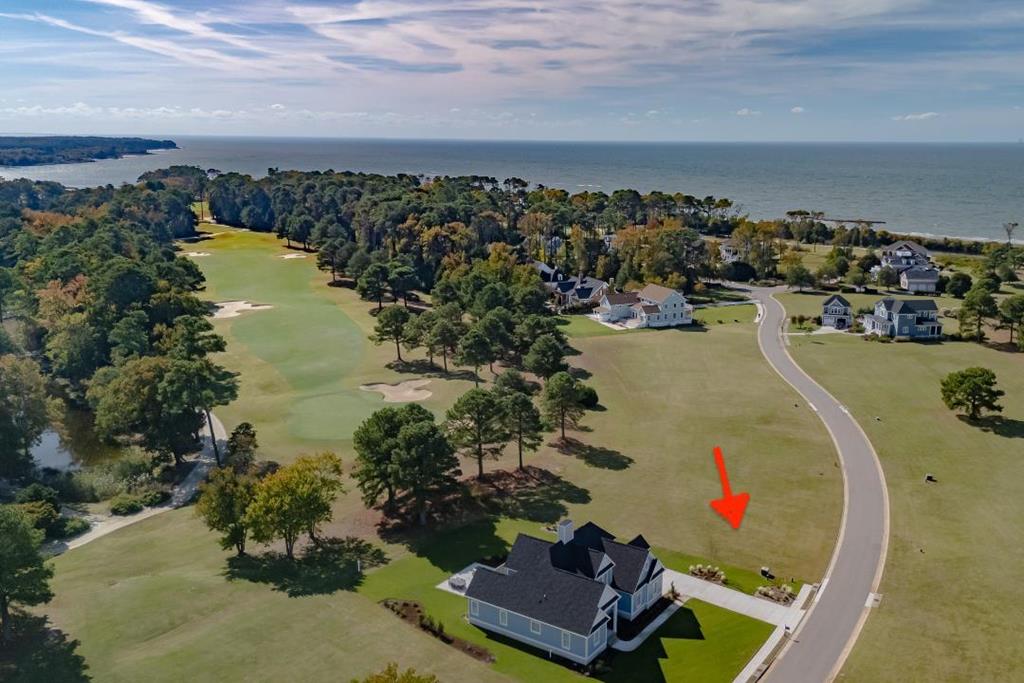 Great building lot near the southernmost point of Bay Creek, Heron Pt. is surrounded by lakes, Old Plantation Creek, and the Chesapeake Bay as well as Palmer #6 hole on the Golf Course. Luxurious homes showcase the distinctive architecture of the Eastern Shore. Enjoy the amenities of Bay Creek You have the opportunity to join a members-only beach club and fitness center, walking trails, swimming pools, the Coach House restauraunt and a private 2 mile beach. Also hop in your golf cart and visit the historic town of Cape Charles with its unique shops, restaurants, coffee house, bakeries, icecream shops  and much more.