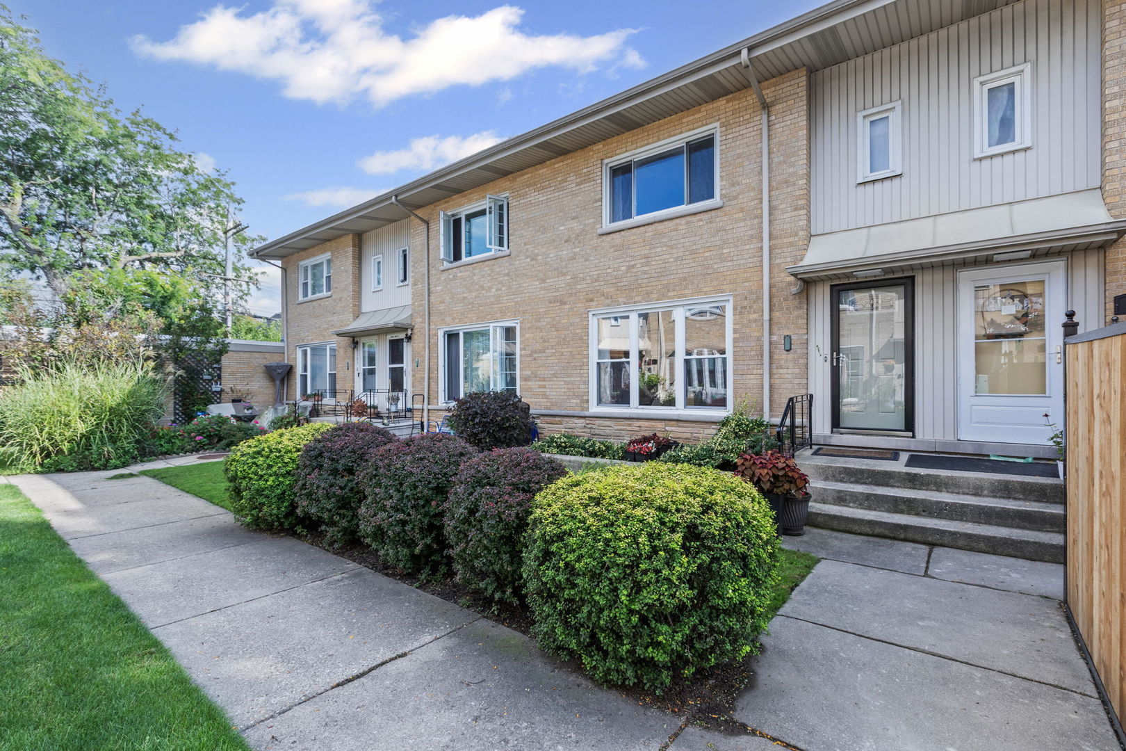 Stunning 2 bed/2.5 bath brick townhome with a private entrance nestled in a quiet courtyard setting. The home has hardwood floors that flow seamlessly throughout the main level with a large window allowing natural sunlight to fill the room. The living and dining room is perfect for entertaining your friends and family. There is a half bath off the kitchen that has been beautifully updated. The kitchen has white 42" shaker cabinets, granite countertops, stainless steel appliances that were replaced in 2024, excluding microwave and ample space for a breakfast table. Upstairs you will find generous size bedrooms with hardwood floors and a walk-in closet in the primary bedroom. The full bath has been tastefully remodeled with a large soaking tub. The basement is fully finished with a recreation room, wet bar, a full bath with a luxurious walk-in steam room and shower, laundry and utility room with sump pump. Major updates include: A/C (2022), furnace (2018), water heater (2018),tear-off roof (2008), Eveready flood control system mechanicals updated (2025), tuckpointing (2025), washer and dryer (2023). Detached garage parking plus easy street parking. Fee simple-no HOA or monthly assessments! Prime location near Whole Foods, award-winning Sauganash Elementary, endless bike trails nearby, Billy Caldwell Golf Course, forest preserves, shops, restaurants, and easy I-94 access. Pet-friendly and move-in ready, in one of Chicago's most desirable neighborhoods.
