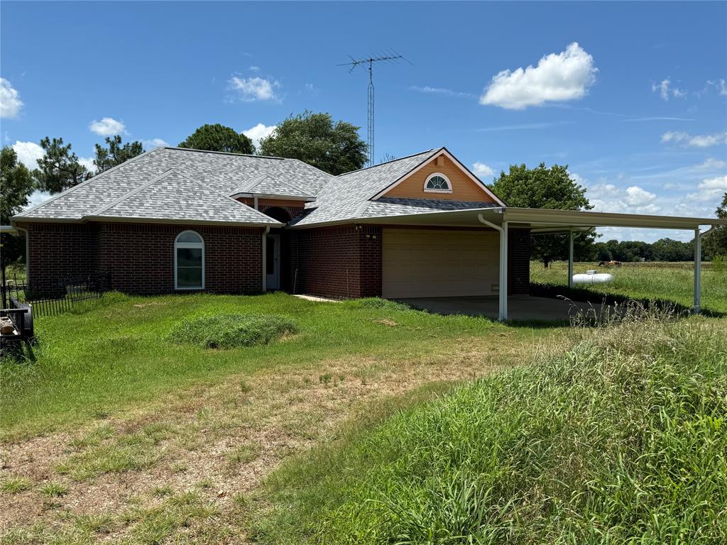 This home is a Must See sitting on over 12 acres. About 3 miles from Commerce, 30x40 insulated shop, 2 storage buildings, numerous pecan
trees, and corner lot. Plus custom built brick with marble, tile and carpet flooring. High ceilings, walk-in closets,
eating bar, superbly maintained, granite counter tops with stone backsplash.