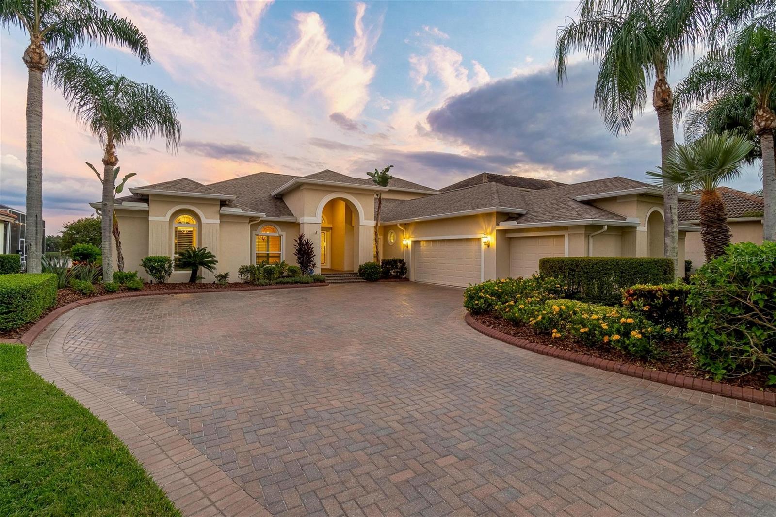 Welcome to 10521 Bermuda Isle Drive, an exquisite 4-bedroom, 4-bathroom home nestled in the prestigious Cory Lake Isles of Tampa, Florida. Boasting 3,731 square feet of luxurious living space, this residence is situated on the expansive section of Cory Lake, offering breathtaking water views and direct lakefront access.

Step inside to discover a home that marries elegance with modern updates. The property has received over $250k in enhancements, including a new roof in 2021, three efficient AC units (two installed in 2017 and one in 2023), and all-new hurricane impact windows, doors, and garage doors from 2019, newly updated pool and spa heaters, also from 2019.

The interior impresses with amazing dual pocket doors in the living area allowing the outside in, expansive tile flooring throughout, a home office with custom built ins, a downstairs secondary en suite bedroom, and a beautifully updated primary suite with spacious bath and dual walk in closets. Enjoy cooking in the well-appointed kitchen, complete with a huge walk in pantry and contemporary stainless steel applicance and granite counters. The spacious rooms flow seamlessly, providing ample space for entertaining or unwinding. 

Outside, the private pool invites you for a swim, with both pool and spa heaters (all conveniently controlled from your phone) and brand new hurricane rated pool cage with minimal bars offering amazing views of the lake.  Sitting on a huge lot as well offering plenty of backyard fun at .41 acres.  This home truly embodies the Florida lifestyle and is ready to welcome new owners who appreciate the perfect blend of comfort and entertainment. Cory Lake Isles features a 165 acre ski lake, resort style pool, amazing clubhouse with gym, basketball court, tennis courts, outdoor roller hockey, sand volleyball court, beach side playground. Bring your boating toys for all the fun!
