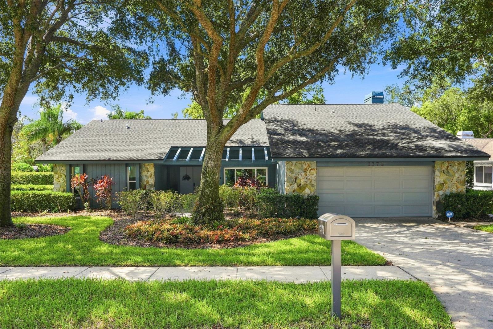 Beautifully updated and thoughtfully maintained, this home offers an impressive combination of major improvements, modern conveniences and Florida lifestyle features. Major updates include a 2020 roof with transferable 10-year warranty, 2021 15-ton inverter-driven 16.25 SEER heat pump system, and seven hurricane-impact windows installed in 2024. The home also features increased insulation for improved energy efficiency and comfort.The remodeled kitchen features custom cabinetry, concrete countertops and updated appliances, with the dishwasher replaced in 2025. A ZLINE range hood with exterior venting adds both style and functionality. Beautiful prefinished Mullican hardwood flooring with an aluminum oxide finish extends throughout much of the home, while French doors enhance the bedrooms and living areas. The family room showcases an attractive beamed ceiling.Step outside to enjoy the private pool featuring a PebbleTec finish, updated pool equipment and a variable-speed Pentair pump. The pool cage was replaced in 2017, creating an inviting outdoor space for relaxing and entertaining.Additional highlights include an EVO salt-free water treatment system, Wi-Fi-enabled garage door opener, LED lighting throughout, upgraded rocker-style switches and outlets, newer washer and dryer, and a dual-fuel Firman portable generator with installed electrical connection for emergency power.A long list of meaningful updates means the major work has already been done—allowing you to move in, enjoy the home and focus on the Florida lifestyle. Conveniently located to beaches, the Pinellas Bike trail, major urban centers and two international airports. Don't miss out on this opportunity. Schedule your appointment today. Video Surveillance cameras are present on the premises including interior cameras and a ring doorbell camera. Buyers and their agents may be recorded while on the property.
