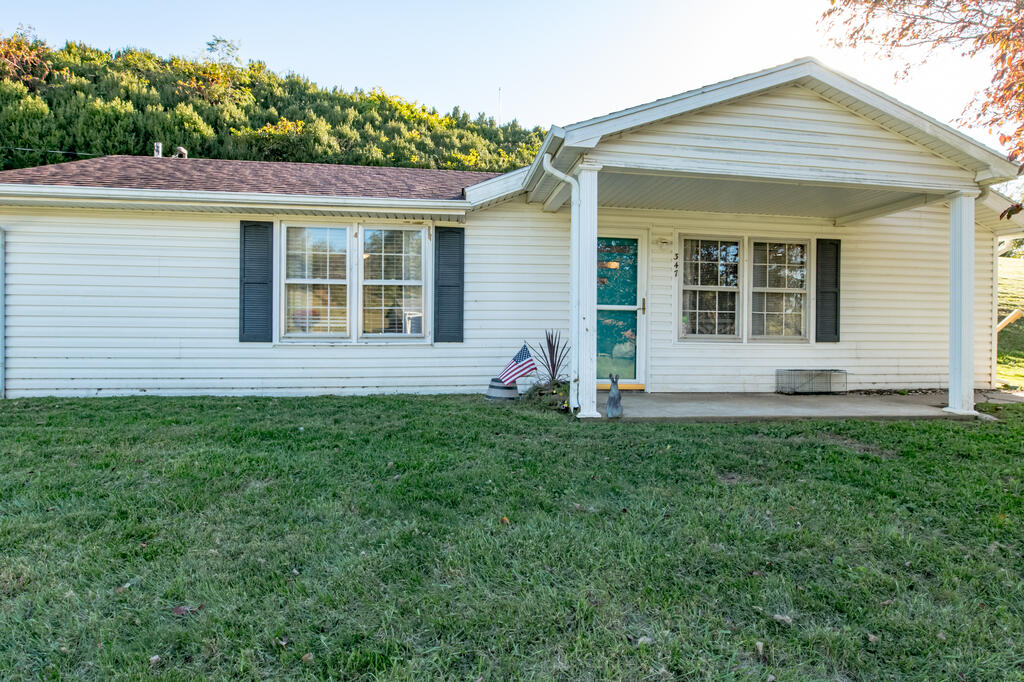 A cute home, a little room outdoors, and the convenience of living in Galax! This cozy 1 bedroom, 1 bath home offers 798 square feet, making it a great option for a first home or anyone ready to downsize. Town water and sewer, along with a newer mini-split heat pump for heating and cooling, add everyday comfort and convenience. The 0.355-acre lot provides space for a garden, pets, or simply enjoying the fresh air, while a small shed offers storage for tools and outdoor essentials.  Located within Galax city limits, you can enjoy small-town living with groceries, restaurants, shopping, and Twin County Regional Healthcare right in town. Spend an afternoon walking or biking the New River Trail, browse downtown shops, catch live music at the historic Rex Theater, or enjoy a movie at the local cinema. Farmers markets, community events, and Galax's rich mountain music traditions give this town a personality all its own. With the Blue Ridge Parkway and New River nearby, there is plenty to enjoy beyond your own backyard. Enjoy the small-town pace while staying within reach of larger cities. Approximate driving times from Galax are 45 minutes to Mount Airy, 1 hour 15 minutes to Winston-Salem, 1 hour 25 minutes to Blacksburg, 1 hour 40 minutes to High Point and Greensboro, 1 hour 55 minutes to Roanoke, and about 2 hours to Charlotte. Whether you're planning a shopping trip, catching a flight, or enjoying a weekend outing, you have plenty of options. A cozy place to start your next chapter!