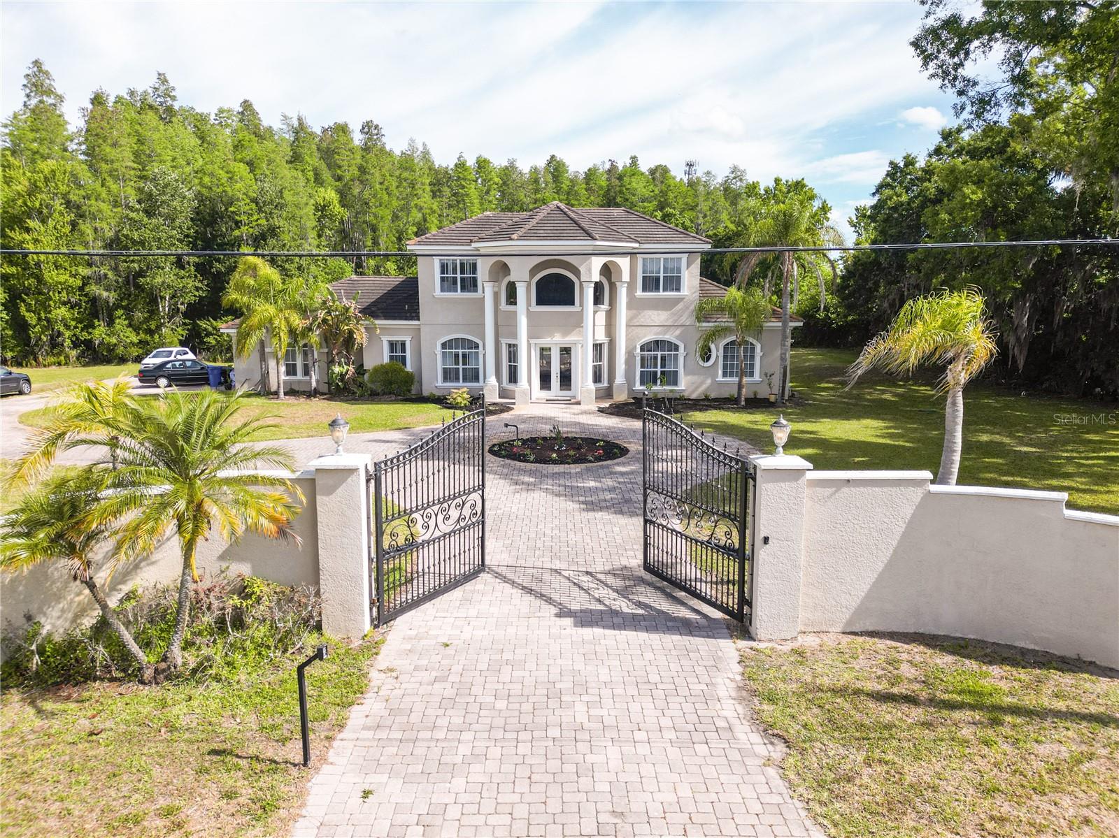 BEAUTIFUL CUSTOM BUILT HOME BY THE ORIGINAL OWNER LOCATED IN LUTZ ON A DEAD END ROAD.THIS HOME HAS  A LARGE FOYER ENTRANCE WITH A CUSTOM BUILT SPIRAL STAIRCASE. HOME HAS 5 BEDROOMS, 5 FULL BATHROOMS, 3533 SF,  3 CAR GARAGE. PRIMARY BEDROOM AND 2ND BR LOCATED ON FIRST FLOOR. 3 BRS WITH ENSUITE BATHROOMS ON 2ND FLOOR. KITCHEN HAS NEW OVEN AND NEW  STOVE, REFRIGERATOR LOOKING INTO FAMILY ROOM WITH FIREPLACE. BEAUTIFUL ENCLOSED POOL WITH LARGE COVERED LANAI, ON 7.5 ACRE CONSERVATION LOT.  NO HOA  REQUIRED.