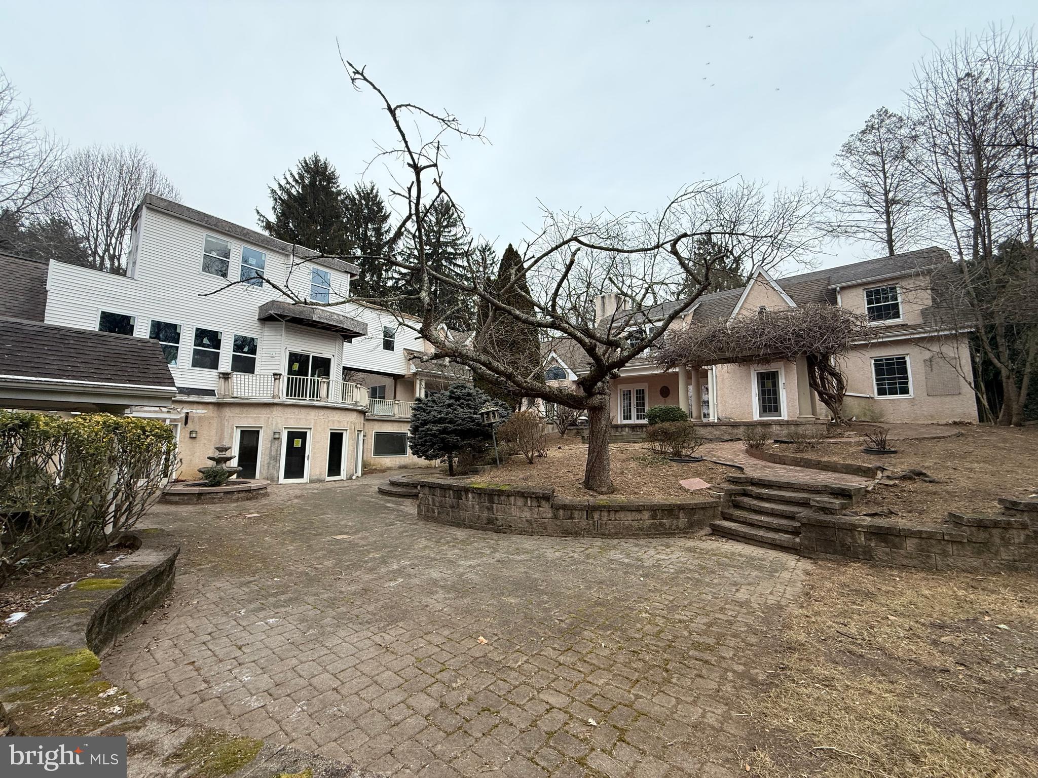 **Diamond in the Rough in West Goshen, PA – Investor’s Dream**This grand property, has 5.1 secluded acres in desirable West Goshen, 301 Westtown Way offers more than 13,500 square feet of extraordinary potential. This house features 9 bedrooms, 9 full bathrooms, and 1 half bath, along with three kitchens, an indoor pool, a custom home theater, and a fully finished walk-out basement.A dramatic glass atrium filled with natural light creates a unique indoor-outdoor atmosphere, while additional unfinished wings provide opportunities for expansion or redesign. The property offers exceptional privacy while remaining conveniently located near major routes, Philadelphia, and Wilmington.The home requires extensive renovation, but its size, setting, and prime location present a rare chance for investors or visionary buyers to transform this estate into a standout luxury property in one of Chester County’s most sought-after communities.