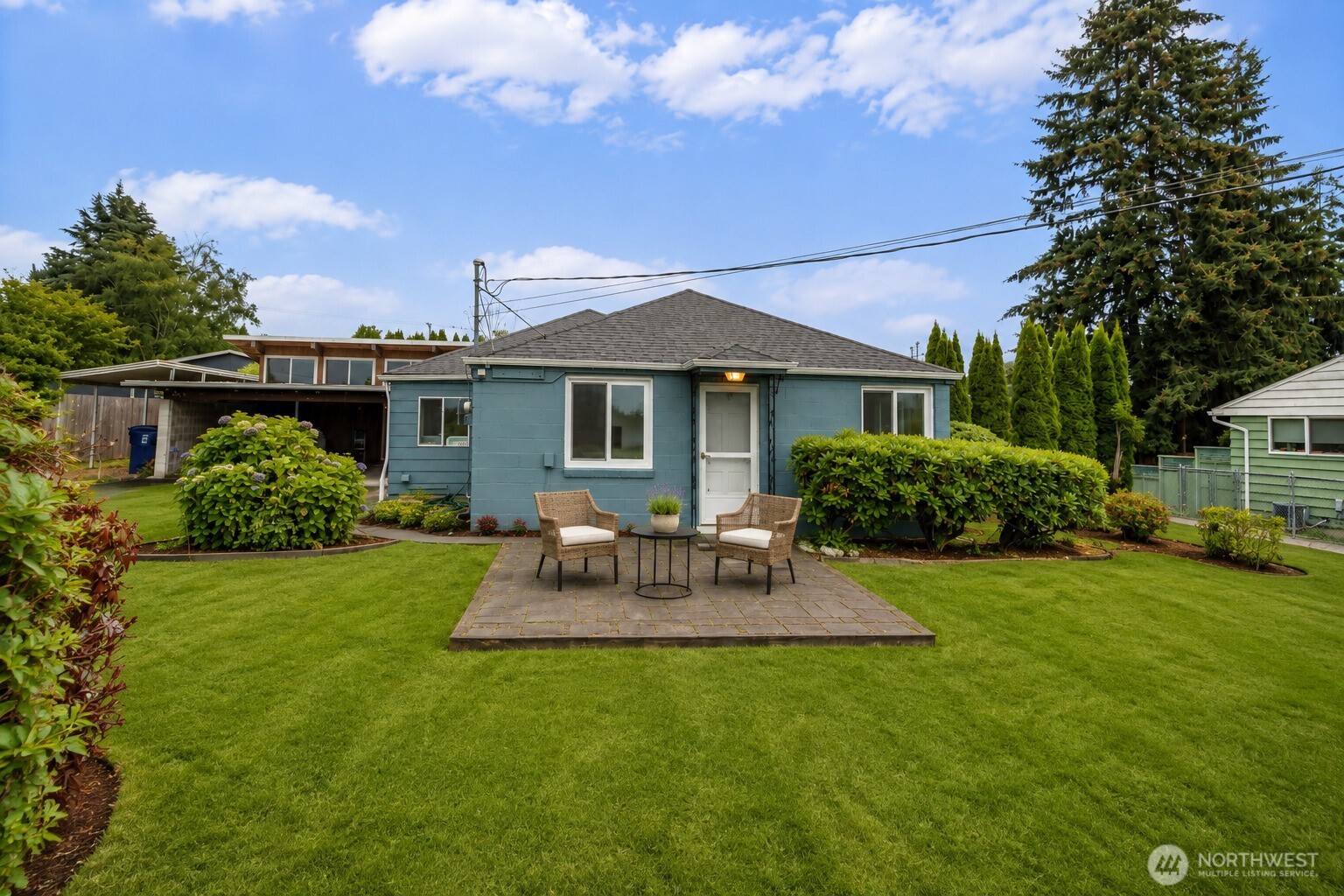 Discover a truly special opportunity near Titlow Park, Day Island, and beach access! This inviting 1-bedroom home offers 948 sq ft of comfortable living space, plus a bonus room/2nd bedroom opportunity and an incredible separate detached 480 sq/ft income producing fully furnished studio (sq/ft not included in the main home's sq/ft). The detached remodeled studio is a standout feature, with vaulted ceilings,  and mini split. This versatile space is ready to become whatever you envision. A creative retreat, home office, hobby space, guest quarters, or income producing rental. Inside the main home, you'll find fresh new paint and new flooring throughout. The living room provides a cozy layout flowing into the newly remodeled kitchen and bathroom. Step outside to your freshly painted exterior and a large, partly fenced backyard filled with possibilities. Great gardens space, a greenhouse, several fruit trees, and a tool shed make this property extra appealing to anyone who appreciates generous outdoor space. You'll love being able to water your garden from your private well while the home is attached to city water. Enjoy peekaboo views of the Narrows Bridge, Fox Island, and the Sound, along with the convenience of nearby parks, trails, and beach access. Unique properties with this much flexibility and outdoor space are hard to find and won't last long. Whether you're looking for a cozy home, creative workspace, rental opportunity and more you'll find it here.