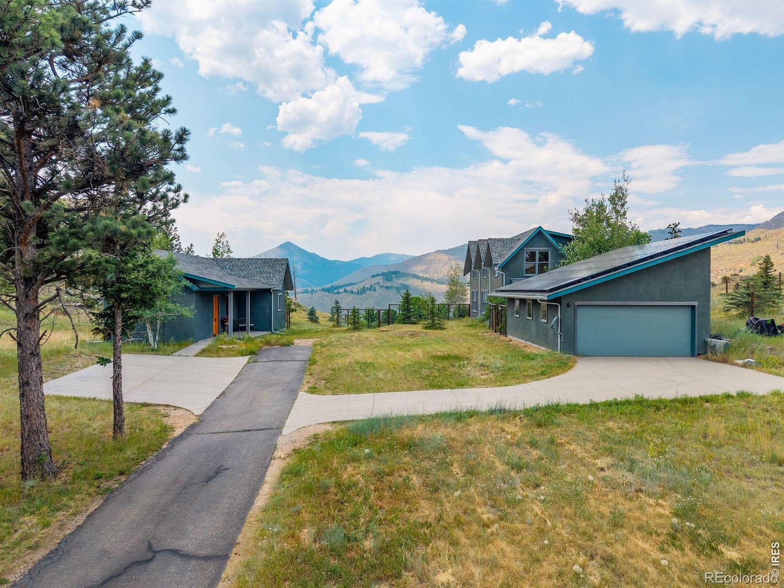 Beautiful Sunshine Canyon home with seperate Office/ADU only 10 minutes from Boulder all on the paved road. Built in 2010 by local architect and builder with no expenses spared, eco friendly, off grid living and fire resistant materials. Amazing craftsman style woodwork throughout with mahogany trim, railings, solid core doors and built in features along with gleaming Brazilian cherry hardwood floors. Step into the home with a large entry way with slate tile and mudroom/laundry complete with a dog door to a fenced in area for your furry family members to enjoy the mountain life. The bright living space was designed for entertaining that seamlessly melds the living, dinning and cooking together with focus on the amazingly appointed gourmet kitchen, featuring Miele appliances and tons of cooking/storage space. Head up the wooden staircase to find the brilliant wood floors continue on to the 3 bedrooms. The large primary has amazing views through the ample windows, the ensuite 5 piece luxury spa-like bathroom is just stunning and you can enjoy a mountain view as you soak in the large tub. The other 2 bedrooms, have tons of ambient light, views and share a full bathroom. Outside of the home sitting on 12 acres, is an oversized detached 2 car garage with solar panels and 2 Tesla power walls and EV charger, detached office/ADU with 2 rooms, front desk and a bathroom, also a greenhouse and large gardens complete the outdoor space. Come live the ultimate Colorado lifestyle with hiking trails on your 12 acres, yet with the convenience of being very close to all of the action in downtown Boulder.