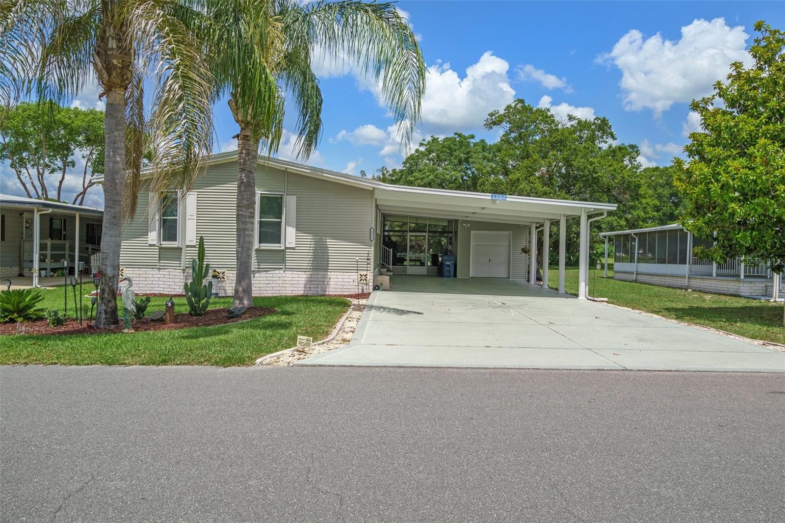 **New Photos showing all recent updates coming Monday**This beautifully updated 1890 square foot 2+ Bed 2 Bath GOLF COURSE home on the #11 Tee has so much to boast. OPEN FLOOR PLAN & HIGH CEILINGS with a bedroom-sized FLEX ROOM/OFFICE that has a French door entry and built in office cabinets. Enjoy your morning coffee in the large sunroom with a golf course view across back of home. The spacious ISLAND KITCHEN offers solid surface countertops and like new appliances. This lovely home offers a master suite with a full length closet and loaded master bath that features a dual vanity, garden tub, and a newly finished custom tile shower. When you are ready to spend time outdoors you can play with with pets in your FENCED YARD or get out of the sun and sit in the extra large LANAI. Hurricane Shutters and Tinted windows. Keep your golf cart or trike in you cart garage/utility room (w/overhead door opener) - Extra large parking area.