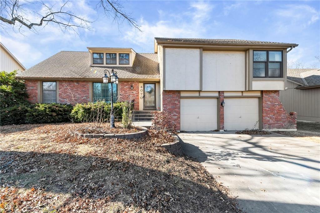 Life is better at the lake—and this beautifully updated, move in ready home lets you enjoy that feeling every day. Situated mid-street just a few streets from the clubhouse and pool, the home offers lake views from the kitchen window. Step out the backyard gate and in about a minute you’re at the water’s edge, connecting to the walking trail, benches, and one of the few streets in Raintree served by its own swim dock.Inside, the home’s unique side to side, multi level layout offers just enough separation for privacy while keeping everyone comfortably connected. Multiple living areas, a loft, spacious bedrooms, and a walkout basement offer flexible spaces to gather, work, play, and unwind.The kitchen—truly the heart of the home—delivers a warm, inviting atmosphere and seamless connection to the family room. Updates include freshly painted cabinets, new countertops, backsplash, sink, faucet, stainless steel appliances, and a new dishwasher.A versatile bonus room off the kitchen and laundry—currently used for storage—can easily serve as a home office, craft room, expanded pantry, workout space, or anything your lifestyle calls for.The home features new hardwood floors, commercial grade carpet in the loft, and refreshed paint, flooring, carpentry, doors, hardware, and lighting throughout. The bedroom level was completely redesigned floor to ceiling, showcasing custom plank ceilings, farmhouse moldings, board and batten, shiplap accents, and two stunning brand-new bathrooms.This home blends comfort, character, and charm in a way that feels instantly welcoming. Located on a quiet street that ends in a cul-de-sac within top-rated Lee’s Summit schools, it offers the ideal balance of community, convenience, and lakeside living. You’re minutes from shopping, dining, the aquatic center, and highway access, while still enjoying a peaceful setting that feels wonderfully connected to nature.Come experience why so many love calling Raintree Lake home.