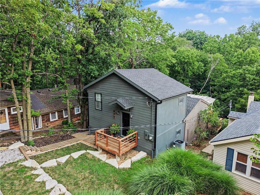 HUGE Price Improvement! Motivated Sellers! Lake life truly is the best life at this adorable first-tier cottage in beautiful Lake Lotawana! This charming 3-bedroom, 2-bath home blends cozy character with thoughtful updates, including a spacious newer addition featuring a private primary suite with a walk-in closet and oversized shower. Enjoy stunning lake views and peaceful wooded privacy from the expansive 500 sq. ft. deck — the perfect place for entertaining, relaxing, or watching the spectacular 4th of July fireworks over the water. Just steps away, launch your kayak, canoe, paddle board, or small fishing boat and enjoy the quiet cove lifestyle. Inside, you’ll find fresh paint, beautiful hardwood floors, and major updates already completed, including the furnace, A/C, roof, and addition — all within the last 5 years. The hot water heater is only a few months old.With 4 parking spaces and a storage shed, this property offers convenience as well as charm. Whether you’re looking for the perfect weekend getaway, an investment property for long-term rental income, or a peaceful place to retire and enjoy lake living full-time, this home is ready for you to start living your best lake life!