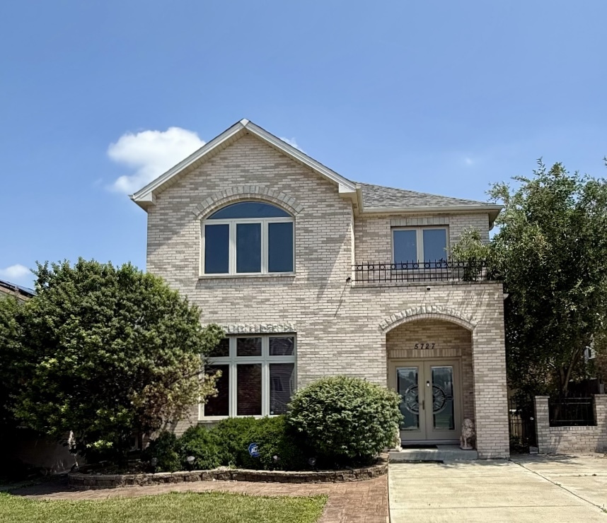 Welcome to this one-of-a-kind incredible 2-story located in Garfield Ridge where street parking is not necessary when you have a private driveway and a garage with upper oversized loft. You'll be welcomed at the impressive double front doors, which lead into a grand marble foyer featuring a stunning dual staircase. The main level boasts open floor plan including a gourmet kitchen with abundant cabinetry, stainless appliances, granite counter tops, stone backsplash, and spacious island overlooking family room with fireplace (which could also serve as a dining area) This level also offers a bright living room, den/office with French doors and a convenient powder room. This custom home features high quality design and finishes, featuring custom molding, detailed woodwork, elegant arched doorways, and vaulted ceilings. Upper-level master with a huge walk-in closet, and spa inspired en-suite. For added convenience, a laundry room is located adjacent to all bedrooms. There is a standup attic with plenty of storage capacity. The finished lower lever features a versatile room with fireplace, as well as an additional kitchen area equipped with stove, refrigerator, sink and cabinets. Step out onto the deck off the family room and retreat to the cedar pavilion in the backyard, which features new beautifully stamped concrete which leads all the way to front of home, a privacy fence and newly installed pool all on an oversized lot. This exceptional home seamlessly blends comfort, style, and functionality-offering an ideal setting for both everyday living and entertaining. Don't miss the opportunity to make this beautifully maintained property your next home!