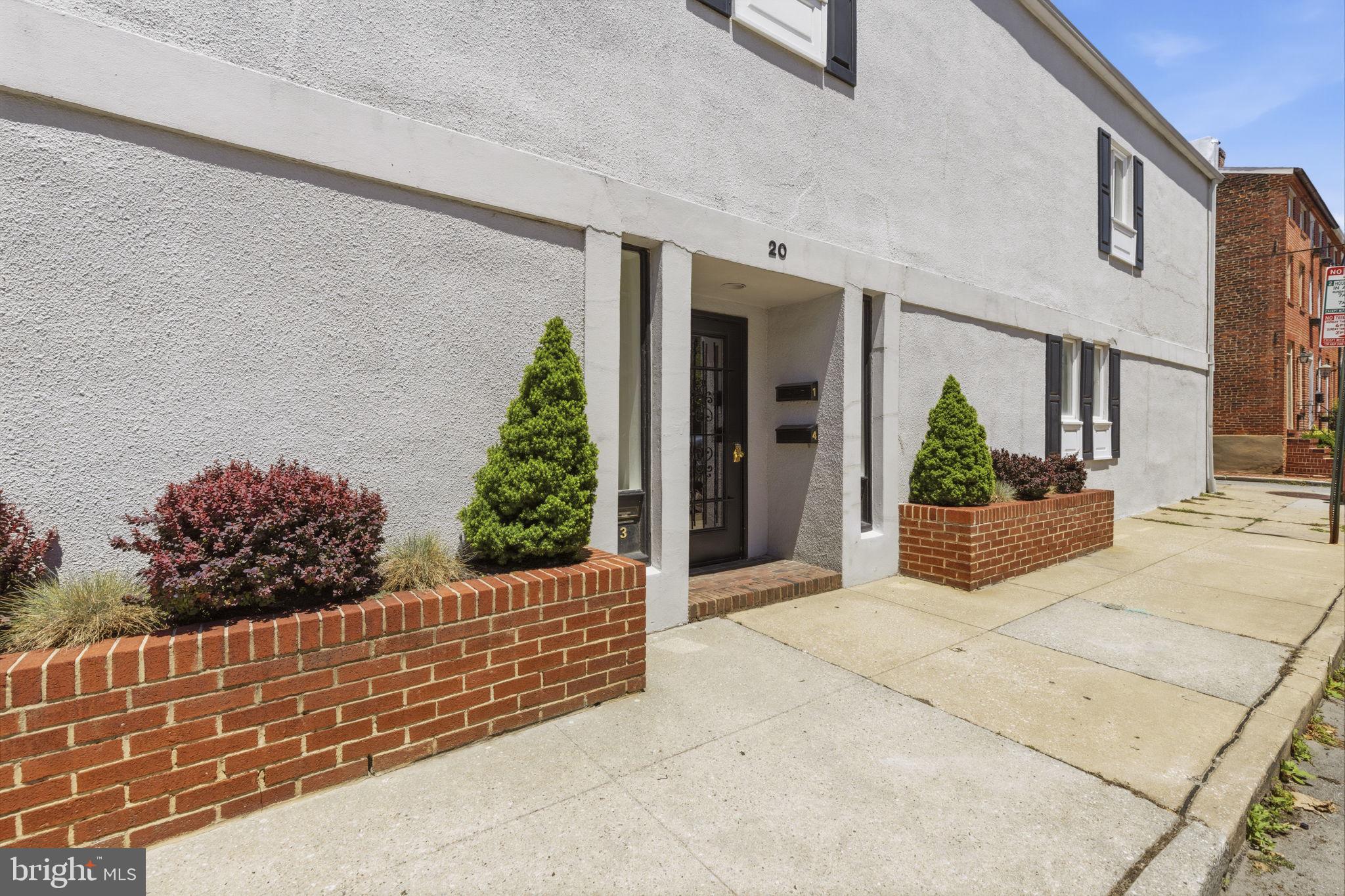 Positioned in the heart of Federal Hill, 20 E Wheeling Street (Unit #2) delivers a sophisticated urban lifestyle across a versatile, multi-level floor plan. The interior features two distinct living spaces, including one anchored by a fireplace, creating separate zones for both lively hosting and quiet relaxation. A dedicated office space provides an ideal environment for remote work, while the private balcony and a shared courtyard offer peaceful outdoor retreats from the energetic pace of the city. The layout is completed by two bedrooms and one and a half bathrooms, all designed to maximize space and natural light. Uniquely equipped for city living, this residence includes a private, attached one-car garage - a premium amenity in this historic neighborhood. Residents will enjoy seamless access to Federal Hill's renowned dining, cafes, boutiques, and entertainment venues, all just moments from the front door. Adding to the property's turn-key appeal, the semi-annual condo fee provides excellent value by covering exterior maintenance, master insurance policies, and future roof replacements, ensuring low-maintenance living at its finest.