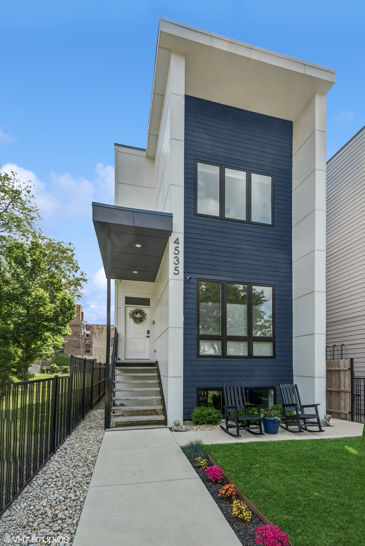 Welcome to 4535 S Evans, a nearly new construction home located in the beautiful and historic lakefront neighborhood of Bronzeville. Built in 2023, this modern residence offers all the benefits of new construction-without the wait. Everything in the home, from mechanicals to finishes, is less than a couple years old.    Set on an extra-deep lot-over 170 feet long-this property boasts incredible outdoor space, including a front yard, an oversized backyard, and a full-length rooftop ready for your dream rooftop deck design.    The expansive, sun-filled main level offers an open layout with a spacious family room, dining area, and sleek kitchen that overlooks the backyard-perfect for everyday living and entertaining.    Upstairs, the primary suite includes a walk-in closet and a spa-inspired en suite bath with a soaking tub, glass-walled shower, and dual vanity. Two additional bedrooms and a second full bath complete the upper level.    The finished lower level features 10-foot ceilings, a generous second living area with a wet bar, a separate guest suite with full bath, and a true laundry room with side-by-side washer and dryer plus utility sink.    Tech-ready and thoughtfully built, the home is pre-wired for sound, cable, Cat5, HDMI, and more-indoors and out-with a centralized access panel in the basement closet for whole-home A/V integration. A Vivint smart security system with cameras, LED control panel, and digital door locks is included.    Surrounded by new development and just minutes from the lake, Hyde Park, and downtown, 4535 S Evans is a modern, move-in-ready home in one of Chicago's most vibrant neighborhoods.