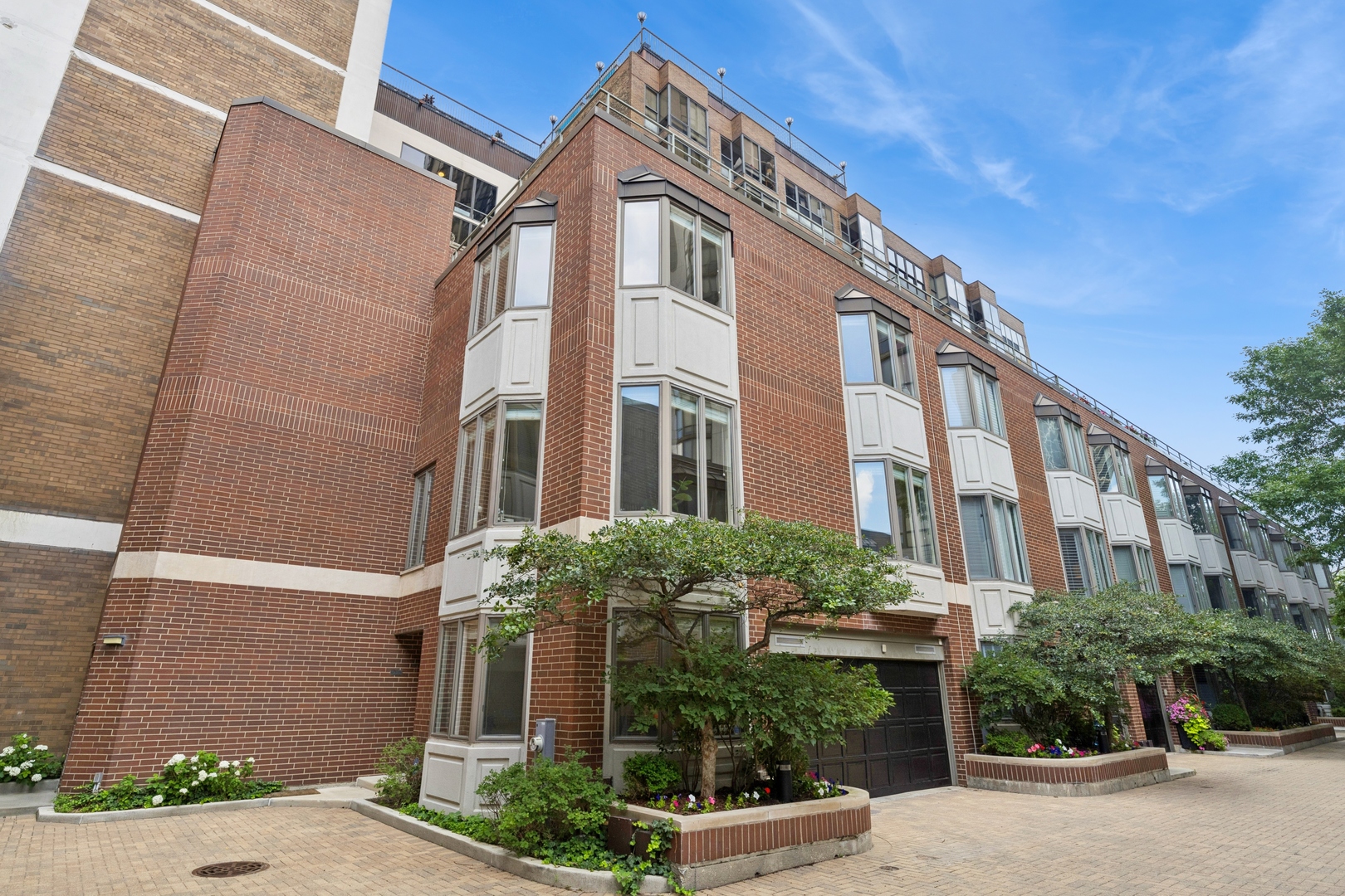 Excellent opportunity to own a rarely available end unit townhome within sought after Eugenie Terrace! Fantastic location with a secure gated community within the heart of Old Town/East Lincoln Park. This townhome is one of vey few with a private rooftop deck + attached 2 car garage. With it being an end unit + skylights, the entire home gets plenty of sunlight. Entire home has just been professionally painted. Hardwood floors throughout with carpeted stairs. Wide floor plan with large living room which flows into the lovely dining room and then into the spacious kitchen. Kitchen features classic style cabinetry, island, granite countertops, stainless steel appliances and a double oven. Expansive primary suite with custom walk-in closet + two additional closets! Primary bath includes separate shower, dual sink vanity and whirlpool tub. 4th floor wet bar equipped with microwave, countertop space, sink, top and bottom cabinetry and room for small fridge. Access door leads to a huge rooftop deck with gorgeous views and privacy! (2021) new furnace, (2018) hot water heater, ac condenser within the last 5 years. Exceptional school district which includes: Francis Parker, Lincoln Elementary, Walter Peyton, Latin, Lincoln Park HS and more. The location doesn't get any better with everything at your finger tips - Lincoln Park with great farmer's market, Lincoln Park Zoo, conservatory, North Ave Beach, Old Town strip full of restaurants. Equinox gym is directly next door!