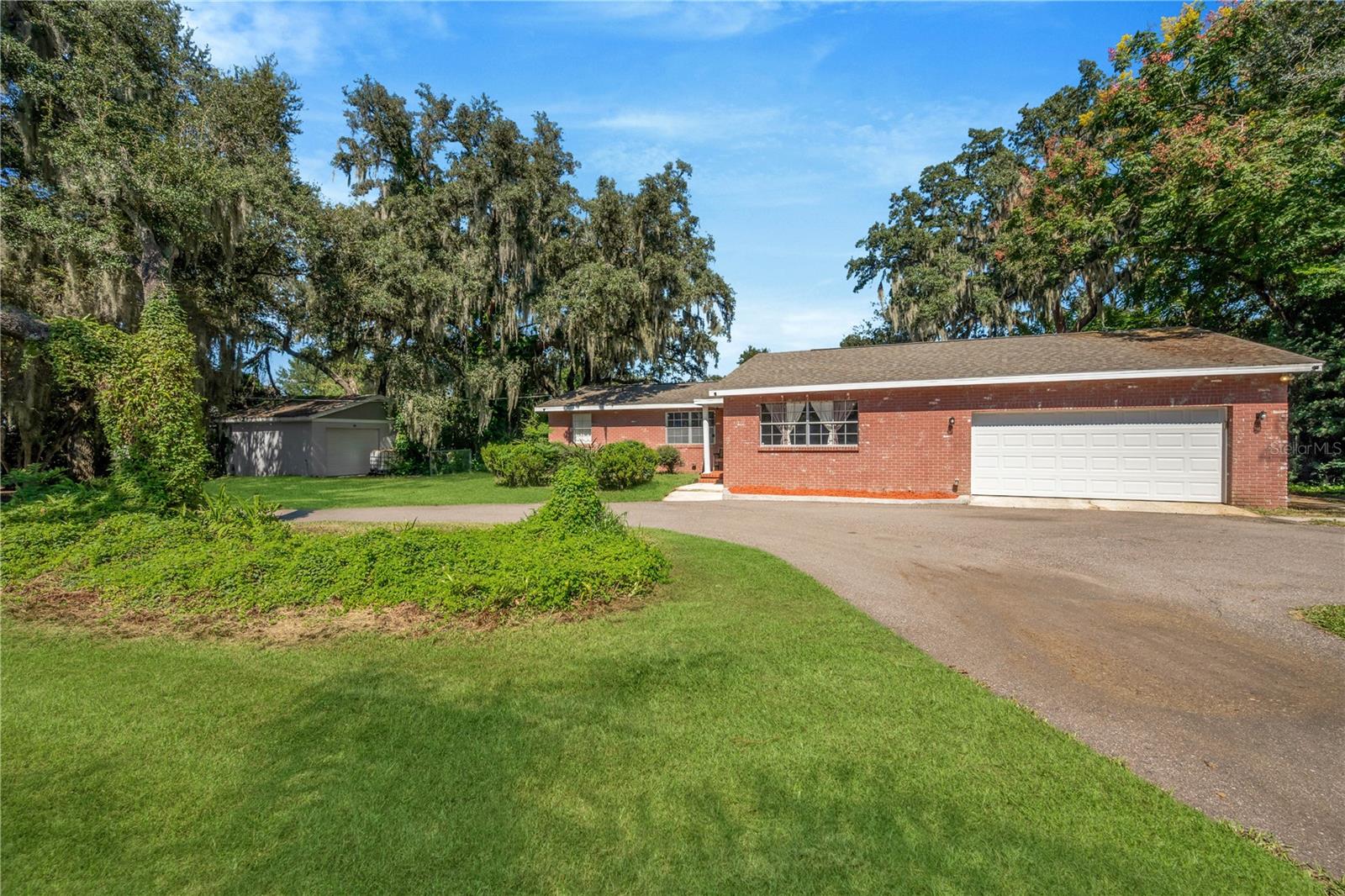 Discover the possibilities with this beautifully renovated property situated on an impressive 0.75-acre lot, offering the perfect combination of space, comfort, and functionality! With 2,047 heated square feet, this home provides plenty of room to enjoy both indoor and outdoor living.One of the standout features of this property is the abundance of garage, workshop, and storage space! In addition to the attached two-car garage, the property features a detached garage offering endless possibilities. Whether you're a car enthusiast, mechanic, hobbyist, or simply looking for the perfect space to create your dream man cave, personal workshop, or recreational retreat, this property has the flexibility to accommodate your vision!Need even more space? You'll also appreciate the additional detached block-constructed shed, ideal for storage, a workshop, hobby space, or a variety of other uses.The home has been renovated and features a new A/C system installed in 2025, adding comfort and value. The property is also equipped with its own well and septic system.Enjoy the freedom of a spacious three-quarter-acre property without sacrificing everyday convenience! Ideally located near major shopping destinations such as Walmart, Home Depot, restaurants, retail stores, and other everyday essentials.Properties offering this much land, versatility, and additional space are worth exploring! Whether you're looking for room to spread out, space for your hobbies, or a property with endless potential, this home offers an incredible opportunity.Schedule your private showing today and discover everything this unique property has!