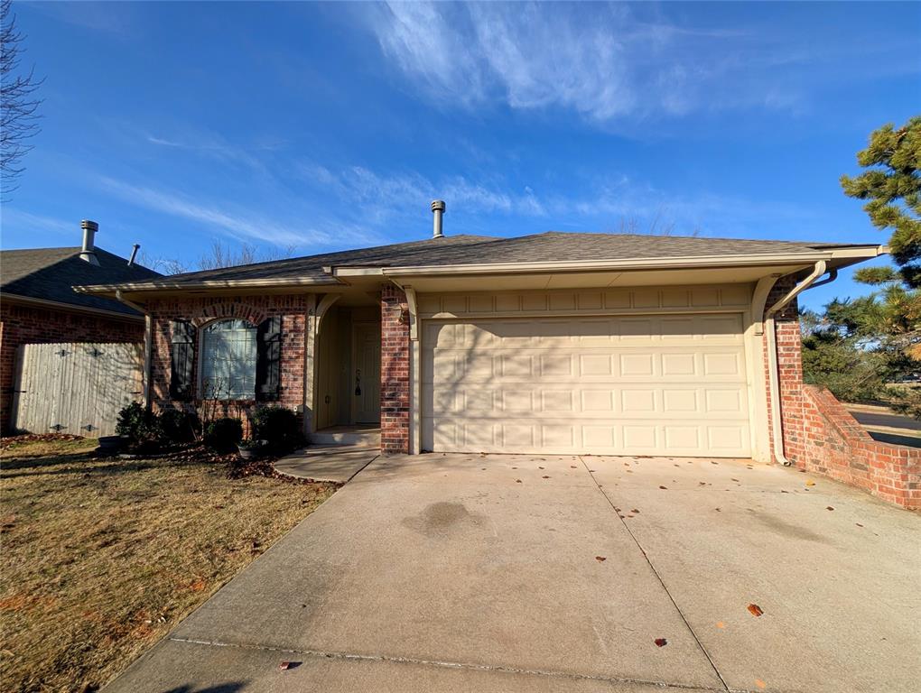 Welcome to this charming home in the heart of Edmond! This inviting property features a spacious open living area with built-in shelving, cozy carpet in the main living space, and tile flooring in high-traffic areas. Enjoy a true fireplace and a generously sized dining area, perfect for everyday living or entertaining. The kitchen offers abundant cabinet and counter space, a large island, side-by-side refrigerator, built-in microwave, and convenient pantry storage located in the utility area. The primary suite includes a private en suite bath with dual sinks, a large walk-in shower, and an oversized walk-in closet. Abundant natural light fills the home, creating a bright and airy atmosphere. Step outside to a low-maintenance, patio-style backyard. Ideally located near shopping, dining, and within the highly sought-after Edmond North School District. Don’t miss your chance to see this wonderful home, schedule your private showing today!