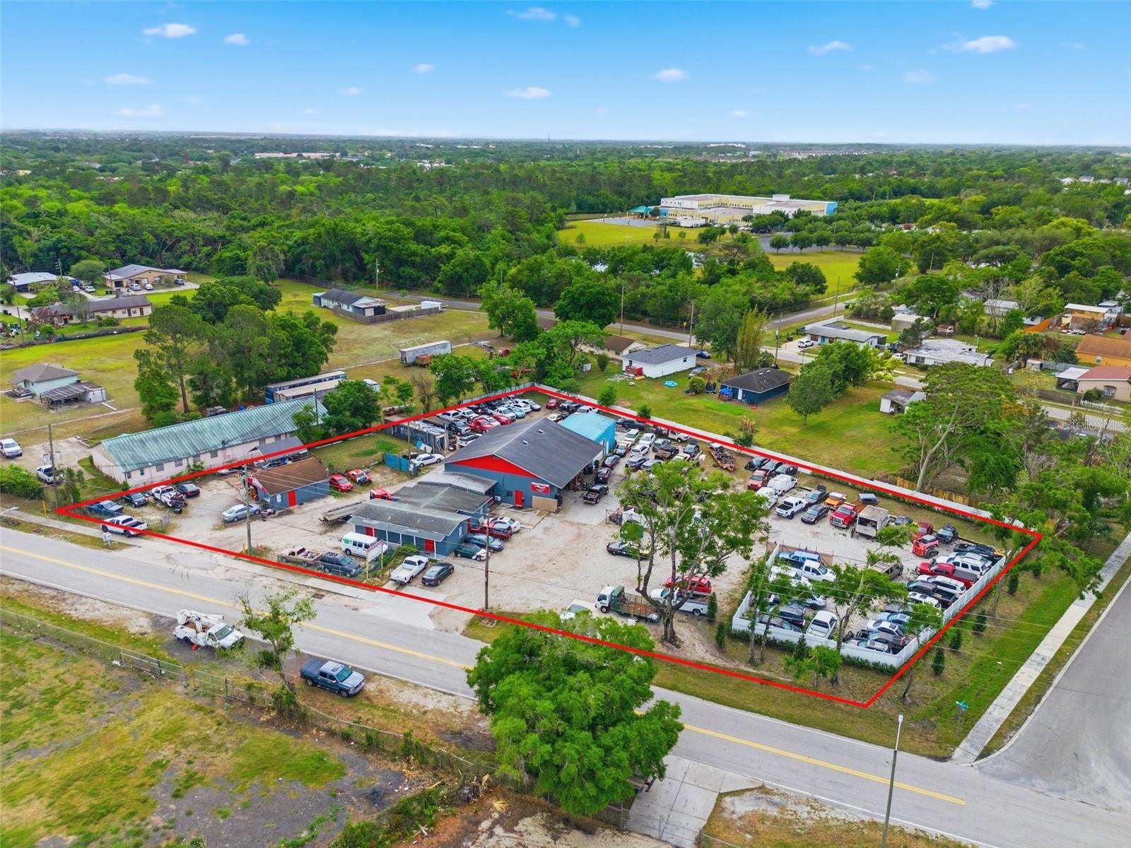 Turnkey Auto Shop & Towing Business + Real Estate | FHP-Approved Operator | Operating Since 2000Presenting a rare opportunity to acquire a fully integrated auto shop and towing business along with the underlying real estate in the Orlando, Florida market. This offering combines a proven operating business with a strategically positioned automotive facility, delivering both immediate operational continuity and long-term asset value.Ownership has operated at this location since 2000, establishing deep-rooted market presence, customer relationships, and operational continuity. The towing division is Florida Highway Patrol (FHP) approved (Troup D) and has maintained 8 years of continuous service as an authorized tow provider, representing a significant barrier to entry and a valuable institutional relationship.The business reflects historical operating performance supported by available financial documentation. The operation includes existing equipment, infrastructure, and an established customer base, providing a foundation for continued operations under new ownership.The real estate component is supported by comparable automotive property sales within the Orlando market, providing a strong underlying asset foundation. The property includes existing month-to-month occupants generating supplemental income while preserving flexibility for future leasing or operational strategies.Includes both the business and real estate, along with an additional 0.51-acre lot, bringing the total to 1.38 acres, allowing for immediate takeover and continued operations.This opportunity provides a compelling combination of operational scale, recurring service demand, and real estate ownership, making it well-suited for operators, investors, or groups seeking expansion within a high-demand service sector.Investment Highlights:FHP-Approved Tow Operator (8 Years) – Established relationship with Florida Highway Patrol; strong barrier to entryOperating at Location Since 2000 – Long-term presence with established reputation and customer baseTurnkey Auto Shop & Towing Business – Immediate operational continuity with existing systems and infrastructureReal Estate + Business Included – Acquire both operations and the underlying asset in one transactionEstablished Customer Base & Demand – Recurring service needs within a high-traffic marketSupplemental Income (~$27,000 AGI) – In-place month-to-month tenants providing additional revenueFunctional Automotive Facility – Infrastructure suited for continued automotive useHigh Barrier-to-Entry Industry – Licensing, relationships, and operational scale limit new competitionScalable Platform – Opportunity to expand towing fleet, services, or operational efficiency