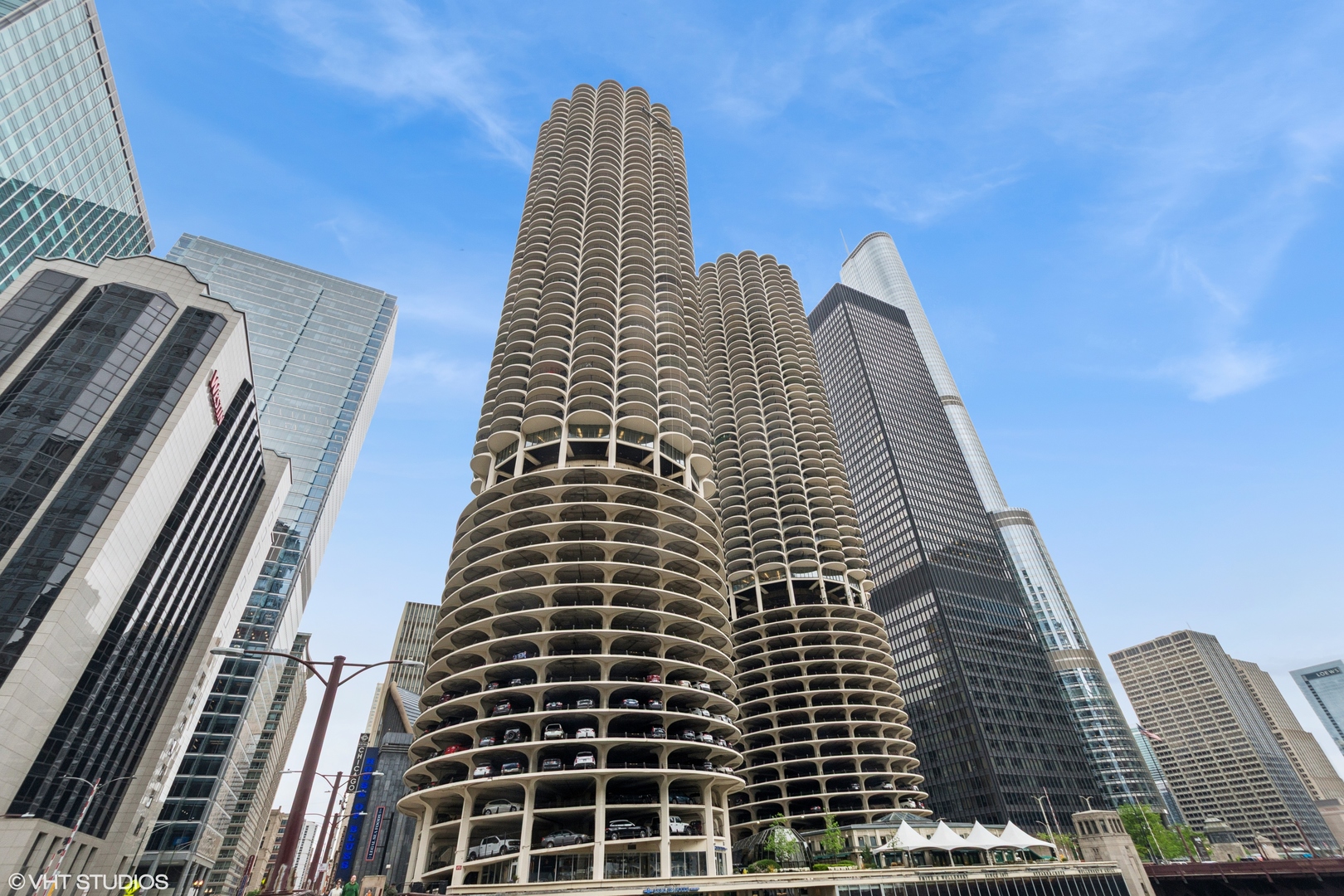 Live in the iconic Marina City Towers in the heart of River North! Enjoy breathtaking views of the Chicago River and skyline from this bright and sunny 1-bedroom, 1-bathroom condo located in one of Chicago's most legendary architectural landmarks. This unit offers an open-concept layout with a spacious living room and kitchen that opens to a private balcony - perfect for morning coffee or evening relaxation. The bedroom also features its own balcony and a separate large walk-in closet. Freshly painted, this home is ideal for both homeowners and investors alike. Marina City offers unmatched amenities, including: 24-hour door staff; fitness center; on-site dry cleaner; grocery store with deli; and a rooftop deck with panoramic views of the city, river, and lake. Additional features include a large storage unit and valet rental parking. With healthy building reserves, no planned special assessments, and a very investor-friendly environment, this is a wonderful opportunity in a prime location. Steps from the Metra, fine dining, shopping, and all that River North has to offer - this is city living at its best!