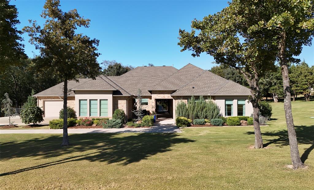 Experience refined Edmond living in this private, gated community just minutes from I-35. Nestled on a wooded lot, this stunning residence offers a seamless blend of sophistication, functionality, and comfort. Generous natural light fills the open living spaces, accentuating designer finishes and thoughtful details throughout. The chef’s kitchen impresses with a large pantry featuring room for a refrigerator and commercial-grade appliances, including a built-in refrigerator and freezer—ideal for entertaining or everyday living.

The backyard retreat showcases a sparkling pool and hot tub, while the front courtyard—with its cozy outdoor fireplace—creates the perfect setting for gatherings year-round. A bonus room near the secondary bedrooms provides a versatile private space, perfect for a playroom, home office, or media area. A private well keeps water costs low, offering easy maintenance for the pool and lush landscaping. Enjoy the serenity of a wooded setting paired with the convenience of Edmond’s premier shopping, dining, and schools nearby.