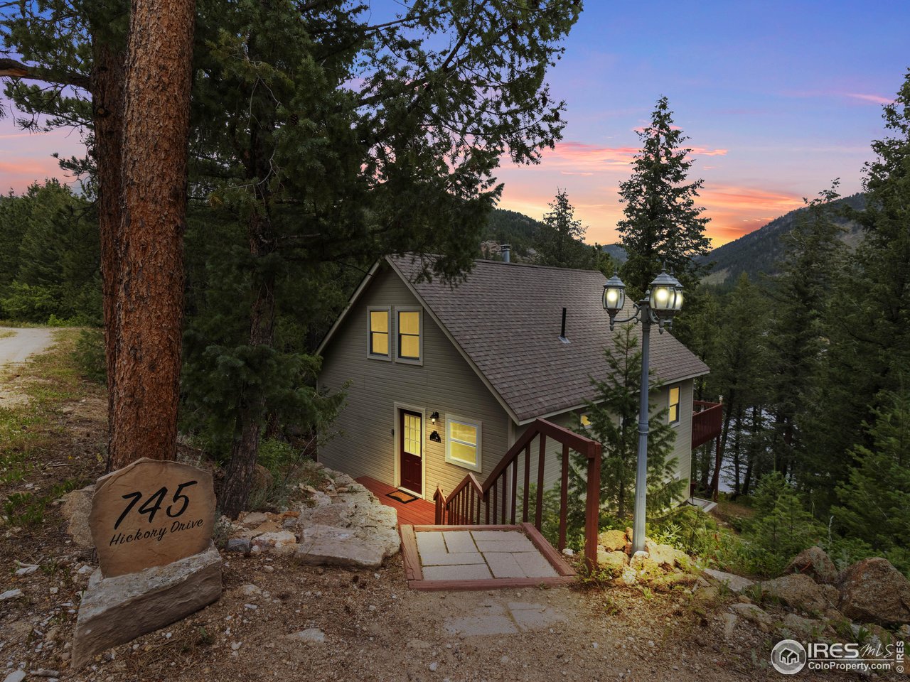 Lakeside Magic in Big Elk Meadows Gated Mountain Retreat. Discover a rare gem in the heart of Colorado's high country. A stunning multi-level, 3-bedroom, 1-bath home perched above the sparkling waters of Mirror Lake in the exclusive, gated Big Elk Meadows community. Step inside and feel instantly at home. The main living area invites you to relax beside a charming antique style wood-burning stove, the perfect place to unwind with your favorite book or a warm drink. Just down the hall, the jetted tub in the main-level bathroom offers a spa-like escape after a day exploring the miles of nearby forest trails. Upstairs, a private deck showcases breathtaking lake and mountain views. It's the ideal setting for morning coffee, sunset dinners, or stargazing under a canopy of pines. Downstairs, a tastefully decorated walk-out basement features newer carpet, an electric fireplace heater, and a built-in surround sound system-perfect for movie nights or cozy evenings. Bonus: the stylish new sectional and furnishings are included, making this a true turnkey getaway. Recent upgrades include: Beautiful wood, tile, and carpet flooring throughout the main living areas. Handcrafted rock retaining wall at the entrance of the home and a flagstone scenic pathway leading to the lake. Down by the lake you will find a brick fire pit and lakeside bench, your front-row seat to alpine serenity. Big Elk Meadows amenities include: 5 private trout-stocked lakes, Heated outdoor swimming pool, Two tennis courts, pickleball, basketball, and volleyball courts. Hiking trails, horseshoe pits, and picnic areas. Roughly 300 acres of shared pasture for horses, Trailer storage, heli-pad, full-time road maintenance, On-site volunteer fire department, community water system, and trash services.This is more than a home-it's a peaceful escape, a smart investment, and your front-row seat to Colorado's majestic mountains.