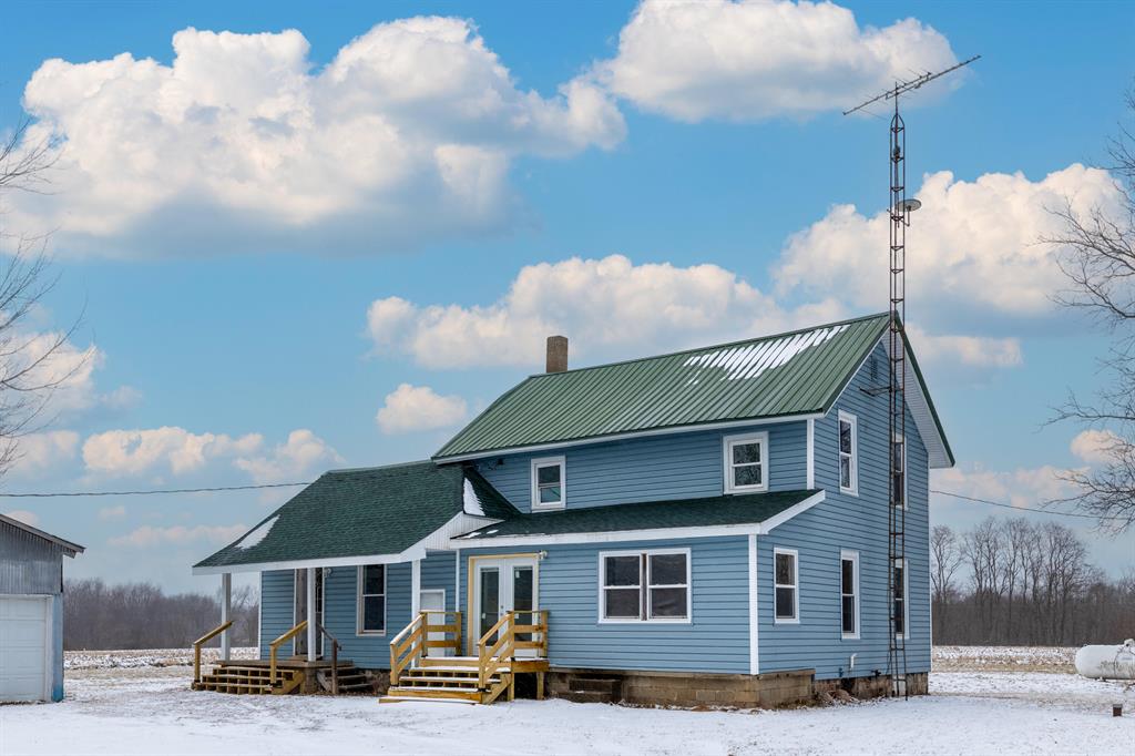 This home has been completely updated and is move in ready! Enjoy the beautiful country setting and the peacefulness  of living on  a quiet road.  You will love the spacious kitchen, new counters, cabinets, lighting, and appliances. There is ample room for hosting large groups and the dining area is positioned right off of the second porch that French doors open up to. The large windows fill the home with beautiful natural light and the tall ceilings provide an extra spacious feel. One of the 4 bedrooms is conveniently located on the main level along with laundry hook-ups and a full bathroom. Moving upstairs you'll find a common area that meets all three other bedrooms, the second full bathroom and views of the entire property. Some of the major improvements that have been made include the following: New furnace JAN 2026, flooring, drywall, lighting, paint, roof, kitchen, bathrooms, porches, new insulation, hardy wired smoke detectors, and more! This home is located between Ann Arborand Lansing which is ideal for commuting via I94 and I96, minutes from downtown Stockbridge, parks, B2B Trails, and great restaurants! Schedule your showing today!