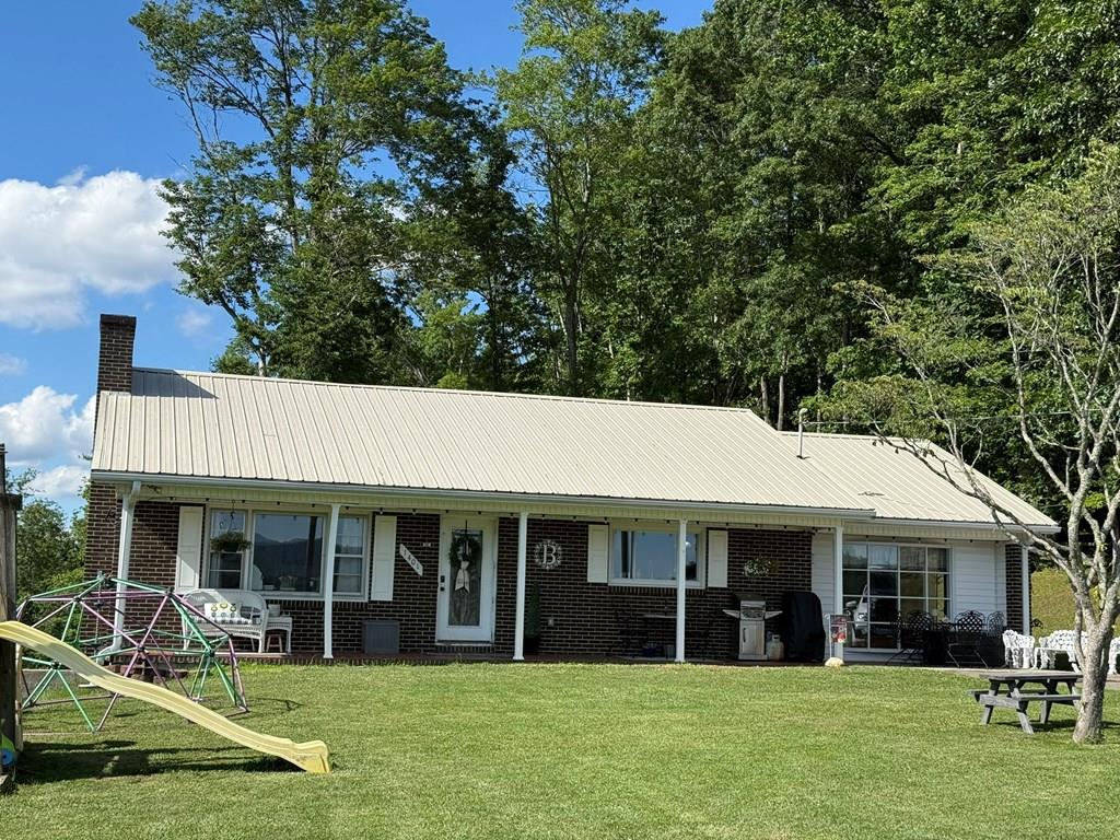 Welcome home to this beautiful ranch in a convenient location near Independence! With thoughtful updates and room to spread out, this home checks all the boxes while being less than 5 miles to Independence and public river access and 10 miles from Galax. The main level features an updated living room with custom fireplace trim, new custom kitchen with stainless steel appliances including a gas cooktop and electric wall oven, 2 generous size bedrooms, a fully remodeled bathroom and sunroom/mudroom. You'll also find an additional room currently being used as a nursery that could easily be an office, playroom or a walk-in closet/dressing area. In the finished walk-out basement, you will find a den area, an office area, a full bathroom and a remodeled bedroom with fireplace. The basement also features a large laundry/utility area with tons of storage. Recent updates include a full kitchen remodel in 2025, a full upstairs bathroom remodel in 2022/2023, new paint and lighting throughout, updated flooring, new closet shelving, tons of cabinetry for storage, new heat pump installed in 2021, propane gas wall heater installed in 2025, newer pressure tank and water heater plus all new plumbing and updated electrical. With four total lots outside, you have 8+ acres to roam with great hunting, excellent mini-farm potential, a paved driveway, covered front porch, gorgeous views and gravel parking area for your lawn mower or tractor. This home is truly one of a kind and is ready for a new family to call it home.
