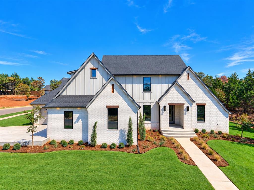 Skip the wait and step into a true custom home where every detail has already been thoughtfully designed for you. This stunning 5-bedroom, 3.5-bath home offers five true bedrooms, a dedicated office, spacious bonus room and storage galore. The heart of the home features a huge walk-in pantry, gorgeous countertops, custom trim details, designer lighting and warm stained wood accents that give the home a cozy, elevated feel. The vaulted primary suite is a retreat of its own, while designer touches continue throughout every space. Outside, enjoy an oversized covered living area with a vaulted ceiling, perfect for entertaining or relaxing. The powder bath conveniently opens to the exterior, making it ideal for outdoor living. Situated on a beautiful corner lot with mature trees and a location convenient to everything, this home offers the craftsmanship and personality of a true custom build without having to go through the process of building it yourself.