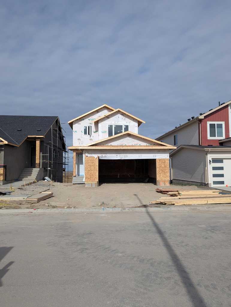 Welcome to this brand new 2026 home brought to you by HOMES BY CREATION, located close to the cul-de-sac, featuring the popular PINE Model in the family-friendly community of Iron Landing, Crossfield. Offering 3 bedrooms, 2.5 bathrooms, and a spacious Bonus room, this thoughtfully designed home provides a functional layout with plenty of space for the whole family. The home features a Side Entrance and an unfinished basement, providing excellent potential to create additional living space and customize the lower level to your needs.Enjoy a fantastic community lifestyle of Crossfield, walking distance to Veterans park, Baseball diamond, skate park, soccer field, schools, shopping, local amenities, and walking/biking paths all conveniently nearby. Plus, enjoy approximately a 10-minute drive to Airdrie Superstore, shops, restaurants, and additional services.A wonderful opportunity to own this brand new home in a growing community while enjoying the convenience of nearby amenities and easy access to Airdrie. $4500 Appliance allowance (GST included).