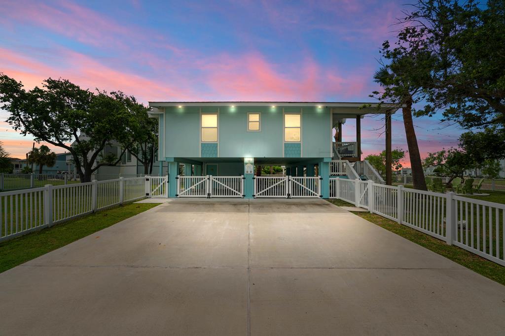 Welcome to 42 Nassau Drive, a beautifully updated 4-bedroom, 2.5-bath home located in the heart of Key Allegro—Rockport's most iconic waterfront community. Situated on a generous 11,400 sq. ft. corner lot, this property offers a rare combination of space, privacy, and island charm just steps from the water.  Inside, the open-concept layout is perfect for both everyday living and coastal entertaining. The spacious living, dining, and kitchen areas flow seamlessly together and are filled with natural light and warm coastal touches throughout. A sunroom with trundle bed adds bonus sleeping space, and the split-bedroom layout offers privacy for guests and family.  Take in the breeze and peekaboo views of Little Bay from the expansive covered upstairs deck that spans the length of the home. Downstairs, a shaded entertainment area features a bar, dining space, and lounge area—ideal for gathering after a day on the water. The downstairs casita has additional sleeping for guests, making this home a true multi-functional retreat.  The fully fenced yard is kid- and pet-friendly, with ample room to add a pool, plus extensive parking for cars, boats, or golf carts. Enjoy walkable access to the community pool, fishing spots, and all that Key Allegro has to offer. Whether you're looking for a full-time home, weekend getaway, or proven income-producing rental, 42 Nassau delivers the best of coastal living—move-in ready and offered furnished (with few exclusions). Come tour today!