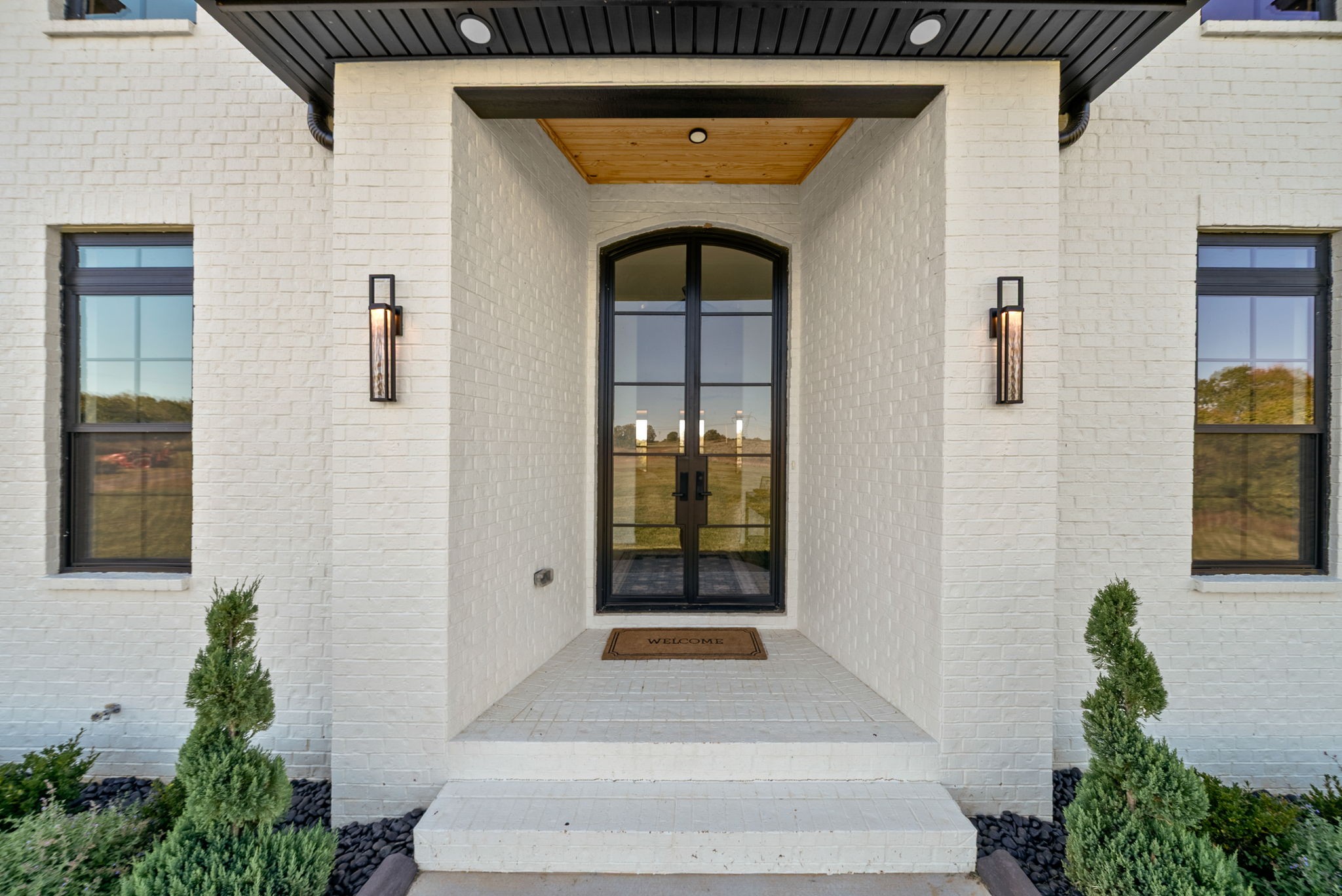 The one you’ve been waiting for 1914 Hickory Point Rd, where space, privacy, and intentional design come together.Sitting on 15 acres, (GREEN BELT) this custom-built home offers over 4,300 square feet, 5 bedrooms, 4.5 baths, a spacious bonus room, and a 3-car garage bringing together thoughtful design and rare acreage in one unforgettable property. You’re welcomed by high ceilings and natural light that create a bright, expansive feel. The open-concept living space is anchored by custom built-ins, floating wood shelving, a sleek fireplace, and designer lighting throughout. The kitchen is a true showstopper. Custom cabinetry, quartz countertops, an oversized island, gas range with pot filler, stainless appliances, and a large walk-in pantry make this space both beautiful and functional The primary suite feels like a private retreat with spa-inspired bath featuring a freestanding soaking tub, tiled walk-in shower, and an expansive custom closet. Just off the suite, a versatile hobby room offers flexible space for a home office, fitness area, or private lounge. Each additional bedroom is generously sized with abundant closet space. The fifth bedroom, located just off the bonus room, creates an ideal setup for an in-law suite, private guest quarters, or extended living space. Sliding glass doors open to a covered porch where open skies and peaceful surroundings create the perfect place to unwind. The 3-car garage includes a built-in storm shelter for added peace of mind. From designer finishes to spray foam insulation, the attention to detail throughout reflects the intentional quality of this home. Surrounded by privacy yet conveniently located near dining, amenities, and commuter routes, this property delivers both seclusion and accessibility. If you’ve been searching for acreage, scale, and intentional custom design. This is the one. What are you waiting for? Come see it for yourself today!