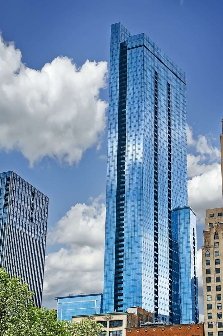 The Legacy at Millennium Park - luxury living at its finest! This high-floor, beautifully upgraded 2 bed / 2 bath residence spans 1,500 sq. ft. and showcases jaw-dropping south and east views of Millennium Park, Buckingham Fountain, Soldier Field, Museum Campus, Monroe Harbor and sparkling Lake Michigan.  Step into a sun-filled living and dining space where hardwood floors, custom lighting, and dramatic floor-to-ceiling windows set the stage.  The chef's kitchen is a showstopper with rich walnut cabinetry, gleaming granite countertops, and top-tier Wolf and Bosch appliances. Retreat to the spacious primary suite, where panoramic views pair perfectly with thoughtfully organized closets and a spa-inspired bath featuring dual vanities, a walk-in stone shower, granite counters, and a soaking tub. The large second bedroom is equally versatile with oversized walk-in closet and a full bath.  Unwind on your private balcony while taking in sweeping lake and city views. Legacy's world-class amenities include an indoor lap pool, multiple outdoor terraces, hospitality suites, fitness center, dry cleaner, and 24-hour door staff.  Premium parking spaces available.