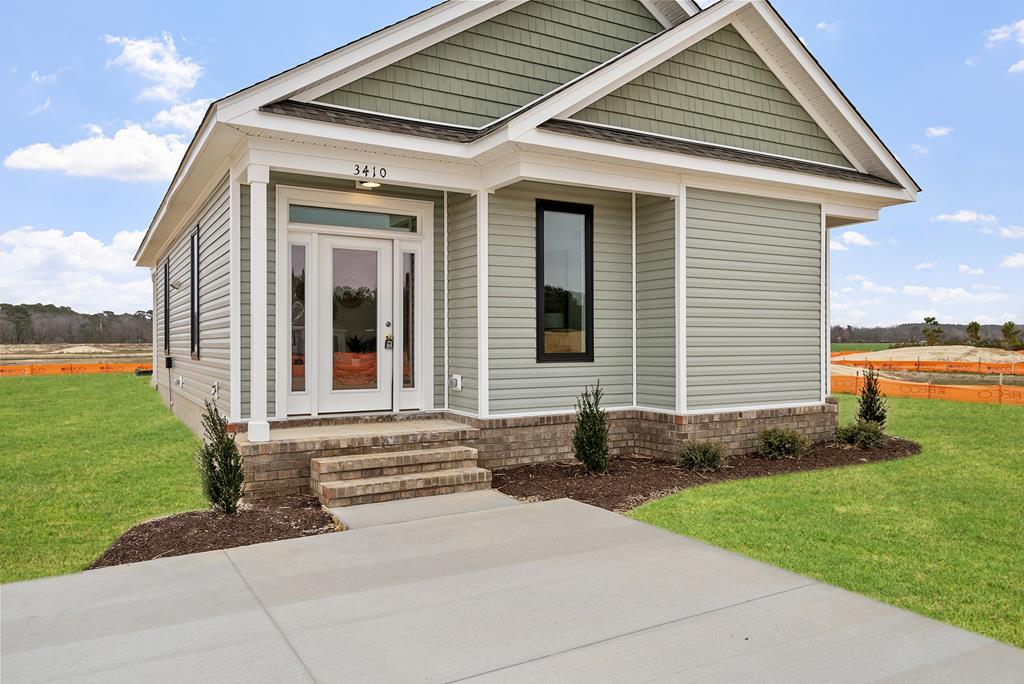 Charming Bayside Bungalow-Just outside of Cape Charles historic district offers the perfect blend of charm & comfort. Open concept living space filled with natural light, modern kitchen, 2 spacious bedrooms with baths, utility room. A covered back porch to relax after a day of fishing or beaching with plenty of yard to expand the outdoor living space!
