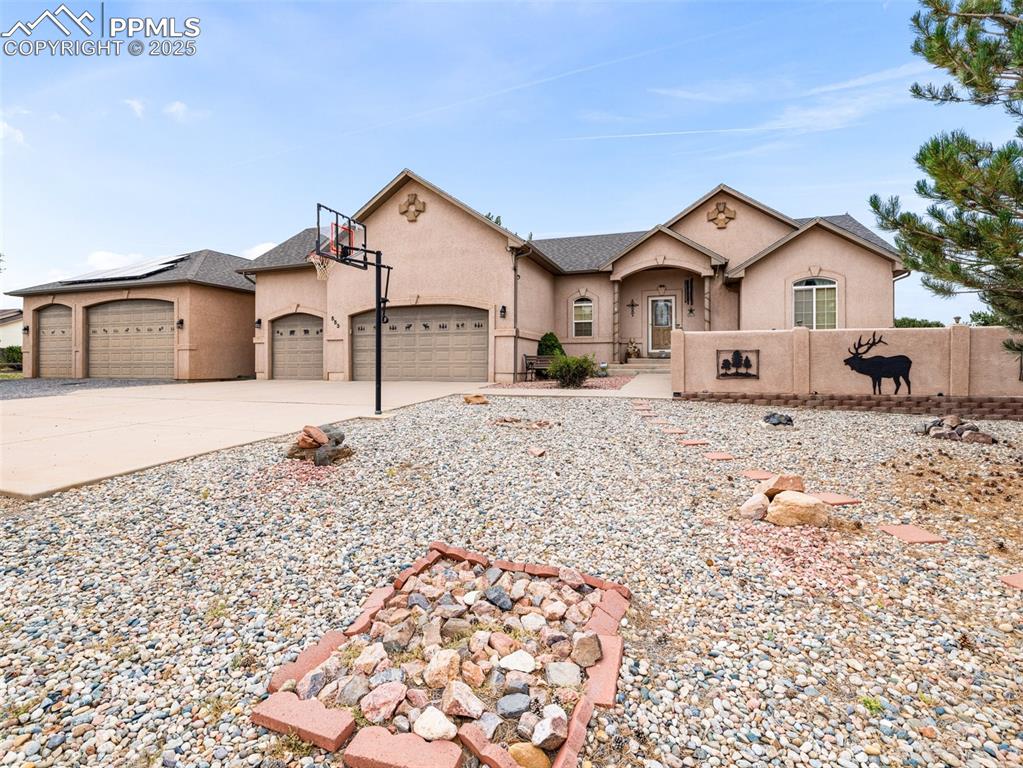 This beautifully maintained home offers the perfect blend of comfort, functionality, and curb appeal. Sitting on a spacious lot in a quiet and desirable Pueblo West neighborhood, this property boasts multiple garages, including a dedicated workshop space! Perfect for DIY projects, car enthusiasts, hobbyists, or anyone in need of serious storage space. Whether it’s your toys, tools, or vehicles, there’s room for it all. Step inside to find a light-filled and immaculately cared-for home with an open and inviting layout and gas-log fireplace. The fully finished basement with built-in bookshelves and 9 foot ceilings, adds valuable living space, ideal for a second family room, guest quarters, home gym, or entertainment area. Outside, the landscaped yard is a true retreat. Thoughtfully designed with mature trees, greenery, and outdoor living areas, it's perfect for both relaxing and entertaining. This home has been lovingly maintained inside and out, with pride of ownership shining through in every detail. From the spotless interior to the pristine exterior, everything is ready for you to move right in. If you're looking for a versatile, move-in-ready property with ample garage space, a workshop, and a finished basement, this one is a must-see.