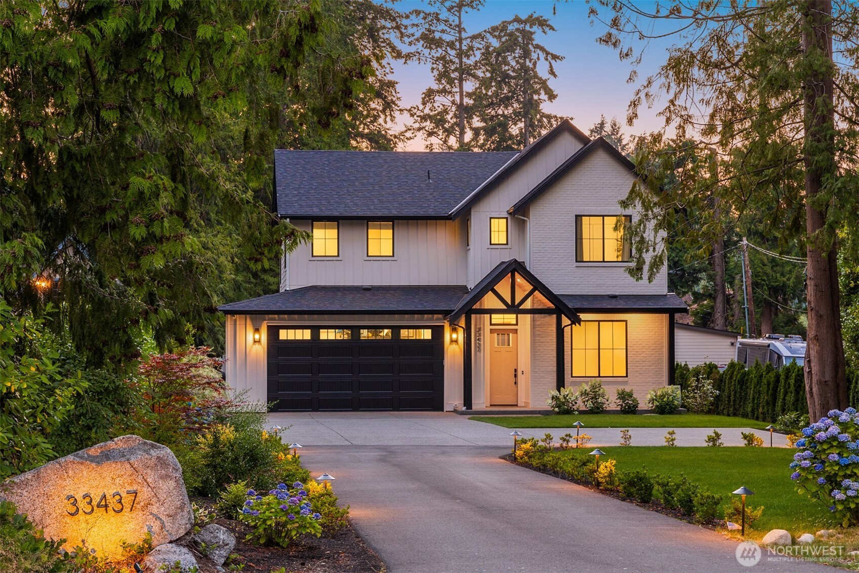 Experience modern waterfront living in this fully custom 2024 masterpiece on North Lake. Offering 2,700 SF, 4 bedrooms, and 2.5 baths, this thoughtfully designed home showcases exceptional craftsmanship, timeless finishes, and a seamless blend of luxury and comfort. Soaring ceilings, walls of windows, and an open-concept design fill the home with natural light while creating inviting spaces for everyday living and entertaining. The chef's kitchen features premium appliances, a gas cooktop with pot filler, oversized island, walk-in pantry, and custom cabinetry, flowing effortlessly into the vaulted great room with a gas fireplace and expansive covered patio wired for a heater. The spa-inspired primary suite offers heated tile floors, a curbless shower, freestanding soaking tub, dual vanity, and a custom walk-in closet. Every detail was intentionally designed, including heated floors in all bathrooms and the laundry room, central vacuum in the home and garage, whole-house water filtration, hardwired driveway lighting, hot & cold exterior spigots, EV charger, backup generator wiring, sprinkler system, oversized garage, & a custom dog wash station. Step outside to your private waterfront dock and enjoy direct access to North Lake, perfect for paddleboarding, kayaking, fishing, or relaxing by the firepit at the water's edge. A rare opportunity to own a truly custom waterfront home where thoughtful design, premium amenities, and the lakefront lifestyle come together. Welcome home!