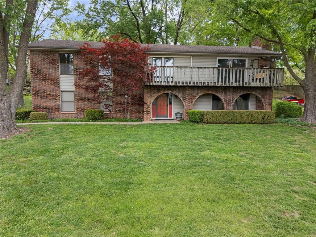 If you’ve been searching for a home where the view makes you pause every time you see it, this is it. Located in Weatherby Lake with the water just across the street and easy access to the W1 access area with a courtesy dock, this property offers an impressive lot and a lifestyle to match. This lake access is easy and convenient. With a setting that delivers both views and accessibility, this property offers a rare opportunity to enjoy the lake lifestyle you’ve been looking for. Thoughtfully positioned as a second-tier home, it provides exceptional value and an opportunity to enjoy the full lifestyle without first-tier pricing.The main level is designed for both comfort and everyday living, featuring a welcoming living room with a fireplace and direct access to the deck, where you can sit back, relax, and take in the water views. A formal dining area flows into the kitchen, complete with custom cabinetry and granite countertops, along with access to a second deck for even more outdoor enjoyment. For year-round comfort, the all-seasons sunroom, heated and cooled, offers the perfect place to unwind while staying connected to the outdoors.All three bedrooms are conveniently located on the main level, including a generously sized primary suite with access to the bathroom and primary closet. An updated hall bathroom serves the additional bedrooms and guests.The finished walkout lower level expands your living space with a large second living area featuring a fireplace and direct views of the water, which truly set this home apart. This level also includes a non-conforming bedroom, an additional bathroom, and a dedicated laundry space, offering flexibility for guests, entertaining, or additional living needs.This home has been well cared for and is ready for its next chapter, offering a rare opportunity to enjoy the Weatherby Lake lifestyle with incredible views, convenient access, and inviting spaces both inside and out.