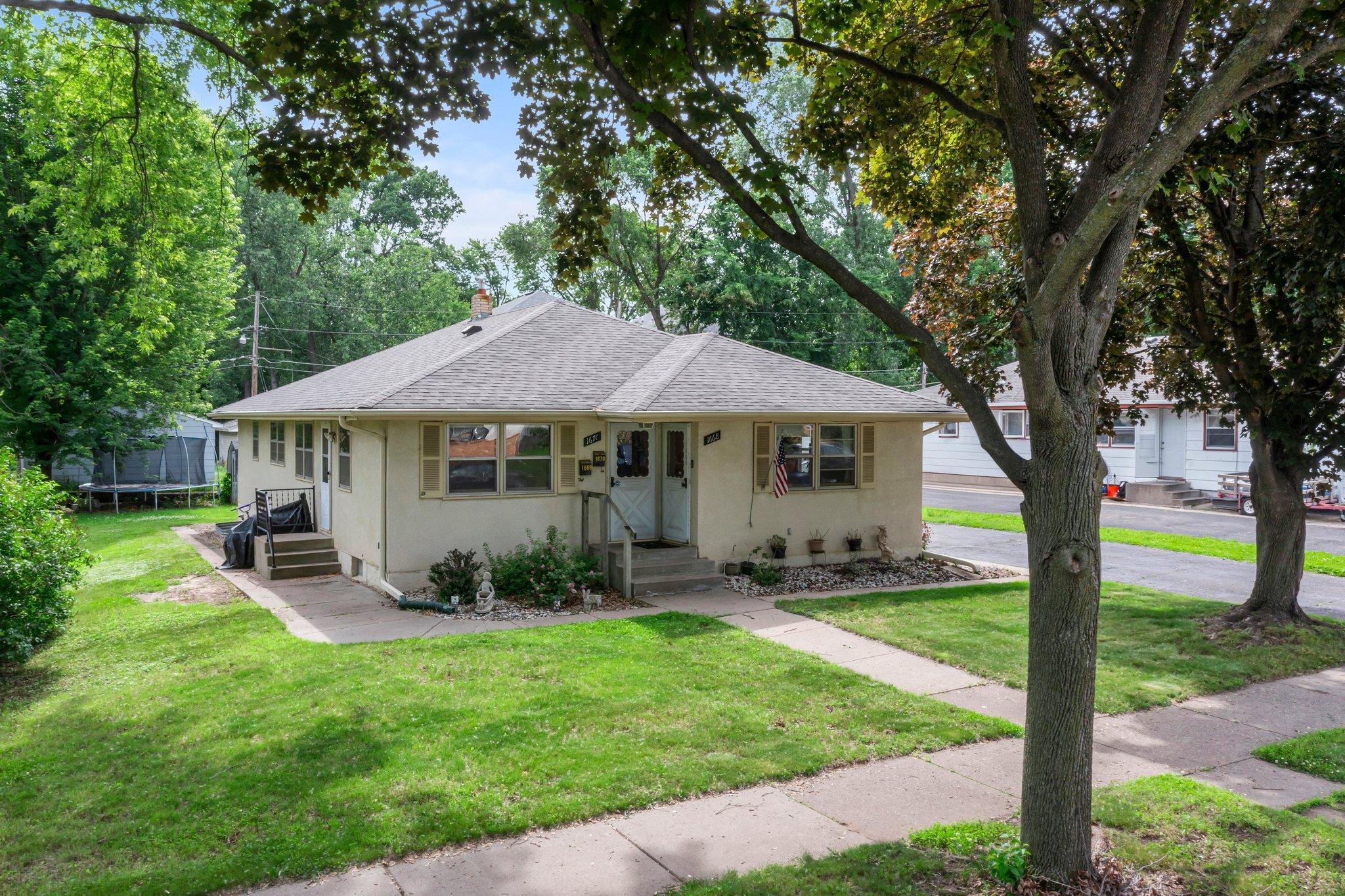 Don’t miss this incredible duplex investment opportunity in a highly convenient and desirable Saint Paul neighborhood—just minutes from Frost Lake, Wakefield Lake, and the scenic shores of Lake Phalen. Surrounded by numerous parks and golf courses, and within walking distance to Frost Lake Elementary School, this property is ideally situated for both tenants and owners alike.
Each side of the duplex—1668 and 1670—offers spacious and functional layouts, with both main and lower-level living areas.
Unit 1668 features two bedrooms on the main level, along with a bright and welcoming living room, a full bathroom, and a well-appointed kitchen complete with its own range, refrigerator, and dishwasher. The lower level offers even more space with a large family room, a bonus room, and generous storage areas. A new stove was installed within the last two years, adding modern convenience.
Also offering two bedrooms on the main floor, Unit 1670 mirrors the layout of 1668 with a comfortable living room, full bathroom, and a kitchen equipped with its own range, refrigerator, and dishwasher. The lower level features a spacious family room and an additional ½ bathroom, and updated finishes including new carpet, fresh paint, and a recently replaced dishwasher.
Each unit has two private entrances—one from the front and one from the side—offering added flexibility, privacy, and convenience. Both units also feature their own dedicated laundry spaces, providing additional comfort and independence for residents.
The property includes a detached two-car garage with a remote-controlled door and a long driveway, offering ample parking for residents and guests. The roof and gutters were replaced within the past four years, ensuring peace of mind and reduced maintenance costs. Mature trees surround the home, offering natural shade, beauty, and privacy in a quiet residential setting.
Whether you're looking to occupy one side and rent the other, or add a solid income-producing property to your portfolio, this well-maintained duplex offers outstanding potential in a fantastic location.