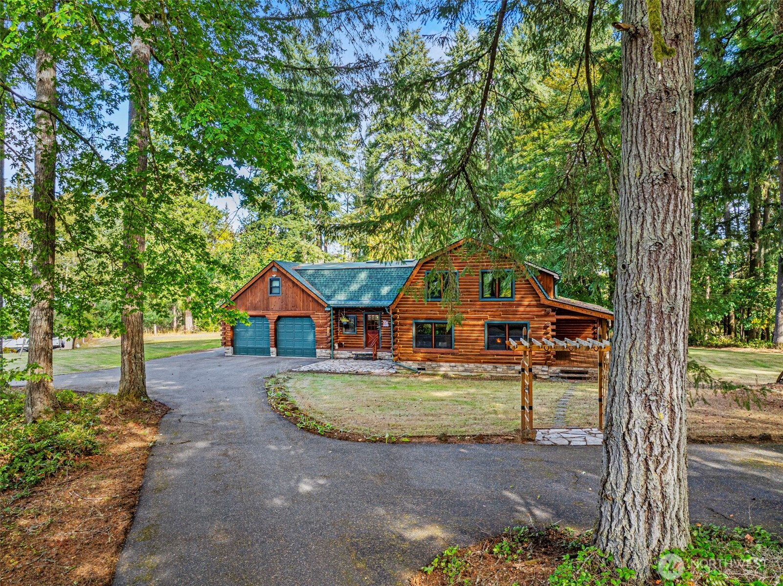 A Unique Log Home Gem, meticulously cared for on a peaceful dead-end road. Property is nearly two acres with greenbelt and serene landscaping . This fantastic home features whole house cooling fan, new Anderson Windows, new roof and a top-of-the-line pellet stove insert for efficient heating. A large 35X40 shop with an Accessory Dwelling Unit (ADU) with parking and good rental history, that could provide extra income. Enjoy fruit trees, deer proof garden, and outdoor fire pit. Large, covered deck, perfect for relaxing. A private balcony off primary suite for enjoying the views with your morning coffee. Unfinished area above the garage for a studio, workshop, or whatever. This outstanding property needs to be seen to truly be appreciated!