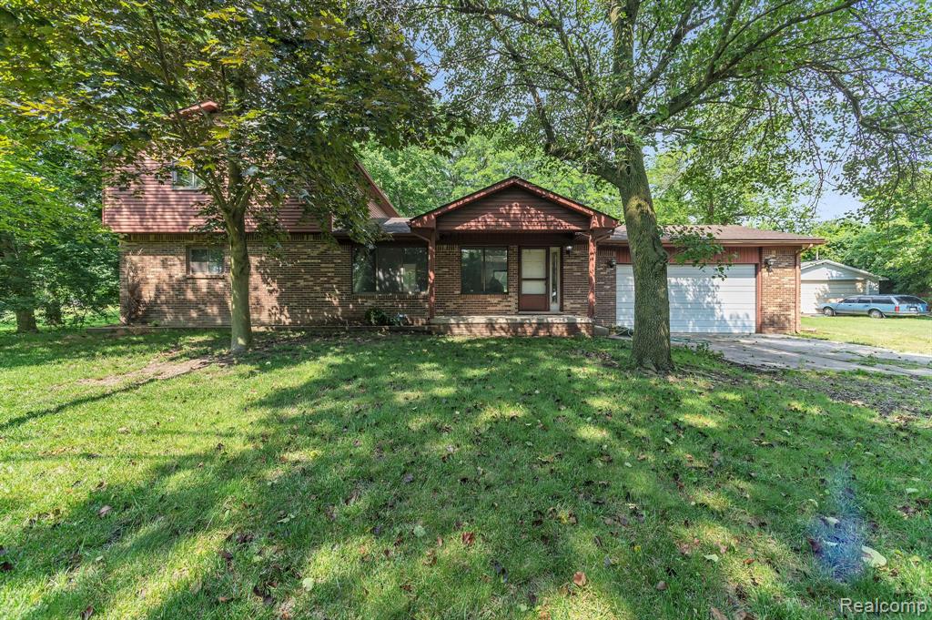 This exceptional secluded Northville property offers 5 private acres and 3 impressive outbuildings with numerous possibilities as well as a completely remodeled home showcasing top-quality craftsmanship throughout. The first outbuilding includes three separate units: Unit A is 43x25 with a full bath, washer/dryer, kitchen cabinets, furnace, hot water tank, 12-foot ceilings, 11-foot overhead door, and floor drain. Unit B is 35x24 with a new steel roof, and Unit C is 46x13. The second outbuilding is a large 42x22 cinderblock structure. The third outbuilding measures 18x16.  All building/pole barns/workshops/garages have cement floors and electricity, 2 of the building have 12 foot ceilings. Whether you need space for storage, work, hobbies, or extra living quarters, the setup here is ideal. The home features 4 spacious bedrooms and two beautifully updated full baths with granite countertops. The kitchen has been fully renovated with granite counters, new stainless steel appliances, and fresh paint and flooring throughout entire home. The large primary bedroom includes a walk-in closet! All new bedroom doors and closets as well as 1st floor laundry and there’s an attached garage for added convenience. The furnace and A/C were replaced just two years ago, and the roof is newer as well. A large poured basement is ready for finishing, and a back deck overlooks the wooded rear acreage with walkable trails—perfect for nature lovers or families looking for space to roam.
The home is tucked away on a quiet dirt road just south of 8 Mile, offering complete privacy yet quick access to major roads. It has a well and newer septic field, though city water is available at the street. Homes like this—with acreage, outbuildings, and so many upgrades—rarely come up in Northville, especially within the desirable Northville School District. This property combines rural privacy with suburban convenience and is truly one-of-a-kind.