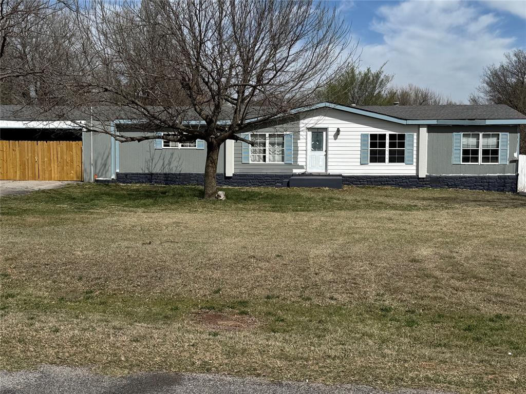 Reduced price and Seller is offering $10,000.00 towards any of the Buyer's costs associated with the purchase of the property. Hard to find 1 acre property in the Mustang/Yukon area. So much potential! Property needs some TLC. It has been a work in progress. Home has 2 living areas, an open kitchen with an island. 3 bedrooms and 2 bathrooms. Home is serviced with public electric and water (Both are turned off at this time) and a septic tank. Natural gas is available, but the meter was pulled before the current owner bought the property and he has never had the gas meter reinstalled. There is a large covered back porch to enjoy, an enclosed area with a hot tub adjoining the master bedroom. There was an inground pool that will require some work from the Buyer to be repaired. The beginnings of a deck for the pool have been started (great bones). Nice metal shop sits on the back of the property; it has 3 overhead doors and a walk thru door. PROPERTY IS BEING SOLD "AS IS" NO WARRANTY OR REPAIRS WILL BE DONE.