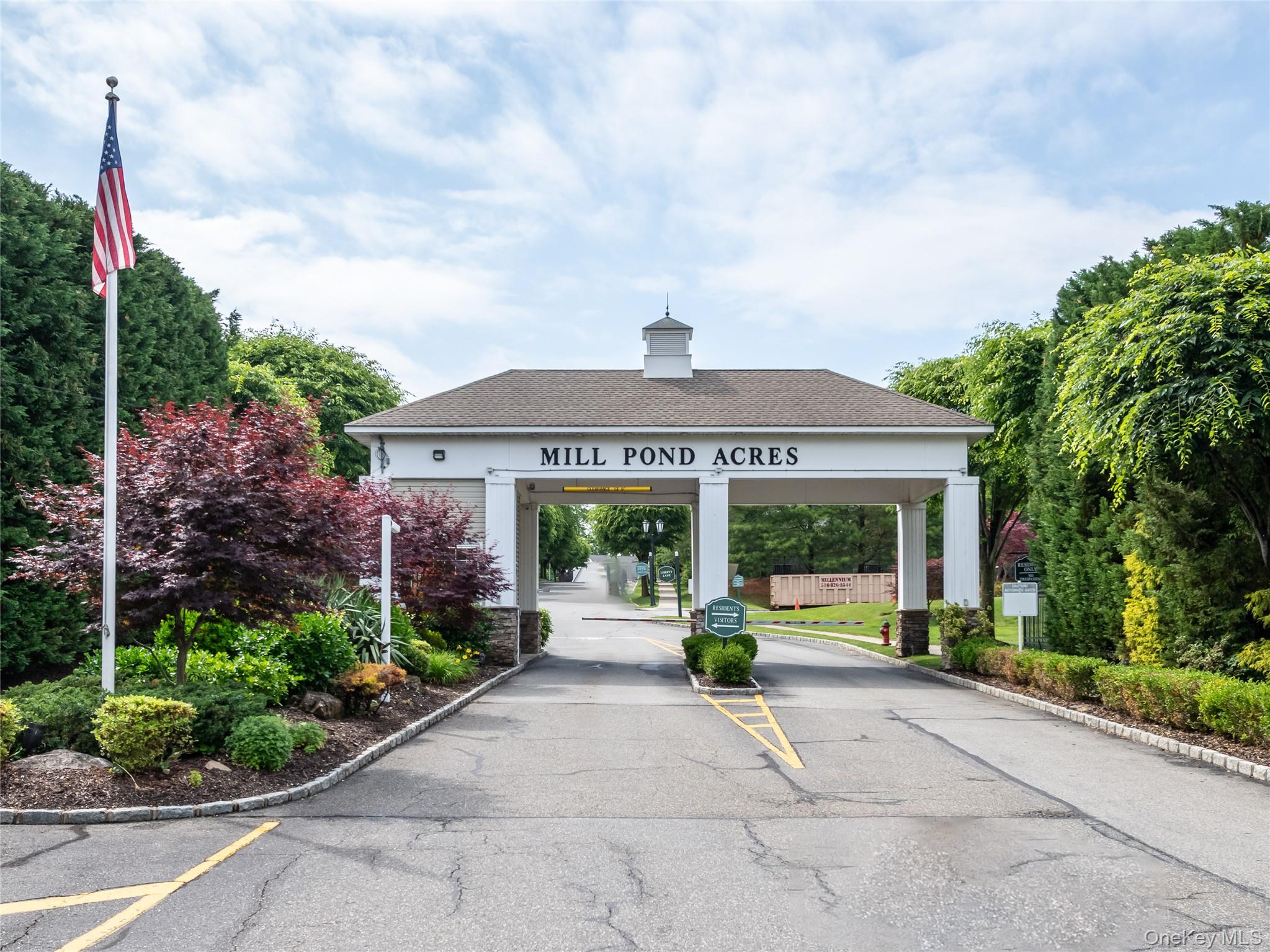 Welcome to this completely renovated, beautiful & sought after end unit  townhome nestled in the  private gated 55+ community of Mill Pond Acres which  offers carefree Country Club living with a club house, tennis, pickle ball, pool, gym and so much more! Enjoy easy living in this  3 bedroom townhome with open living concept with beautiful  new wood flooring throughout , dramatic vaulted ceilings, a stylish  renovated kitchen with high end appliances which flows into the living room with sun filled skylights. A primary first floor bedroom suite overlooks the beautiful gardens. The primary bath has been thoughtfully updated offering a true turn key experience through out .  Laundry and a stylish powder room complete the first floor of this lovely home.  The second level offers two additional bedrooms or office  plus a spacious & airy open sitting room which will be the perfect place to relax & unwind by the fireplace .   Enjoy a serene & private yard dining alfresco experience on your brick patio while admiring the stunning gardens. An expansive retractable awning at simply the touch of a button for additional convenience . A coveted 2 car garage offers  direct access to the welcoming foyer. Clubhouse amenities include fitness room, renovated gathering space,  pool and tennis. Convenient to shopping, restaurants, waterfront and close to train. Jitney service provided by Mill Pond for your shopping & train needs. Truly an opportunity not to be missed.
