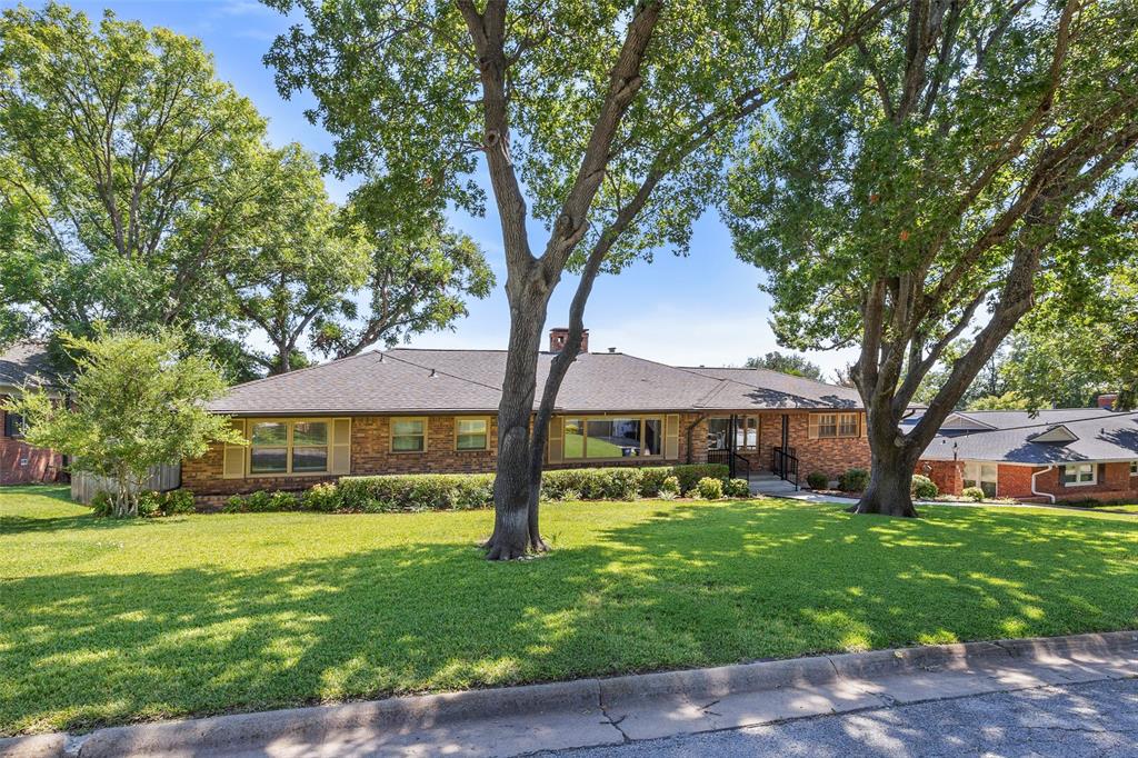 This charming 3 spacious bedrooms, 3 full bath home sits on a spacious .3 acre lot with beautiful curb appeal and gated rear parking located in the sought after Ridglea neighborhood.  Inside, enjoy 2 large living areas with picture windows, formal dining room, and cozy fireplace with gas logs.  Kitchen shines with granite countertops, generous cabinetry and a large built-in pantry.  Separate utility room with built-ins.  Updated primary suite offers dual sinks, a large shower and large walk-in closet.  Step out back to a landscaped yard, open patio and well lit carport perfect for entertaining or extra parking.  Just minutes to schools, shopping, restaurants, and major freeways!