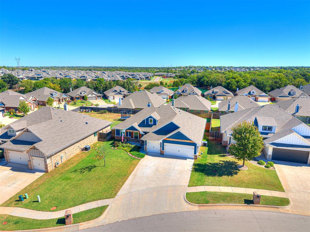 This beautiful four-bedroom, two-bath home with a three-car garage located in the desirable Delmer Lakes community. The thoughtfully designed floor plan features tile flooring throughout the main living areas with comfortable carpeting in the bedrooms. The kitchen has cabinets to the ceiling, built in stainless steel appliances, decorative backsplash, and 3cm granite counter tops. The primary suite boasts a gorgeous ceiling detail, an attached bathroom with a dual sink vanity, walk in shower, whirlpool tub & large walk in closet while the walk-through laundry room provides convenient access directly to the primary closet—a practical feature that makes everyday living easier.The covered back patio offers a wood burning fire place, TV and cable hookups, and a gas line for your grill. This home also provides a whole home air filtration system that will make breathing easy, Rinnai Tankless water heater to provide endless hot water, R-44 insulation and a TechShield radiant barrier to provide more energy efficiency! In the garage you will find a charging station for your electric vehicle.A storm shelter located in the garage offers added peace of mind during Oklahoma weather. Beyond the home, Delmer Lakes offers wonderful neighborhood amenities including a catch-and-release fishing pond, basketball court, greenbelts, walking trails, and an attractive landscaped entrance with a water feature.With four bedrooms, a three-car garage, functional design, and access to inviting community amenities, this home offers a wonderful combination of space, comfort, and lifestyle. Schedule your private showing and discover all this home has to offer!