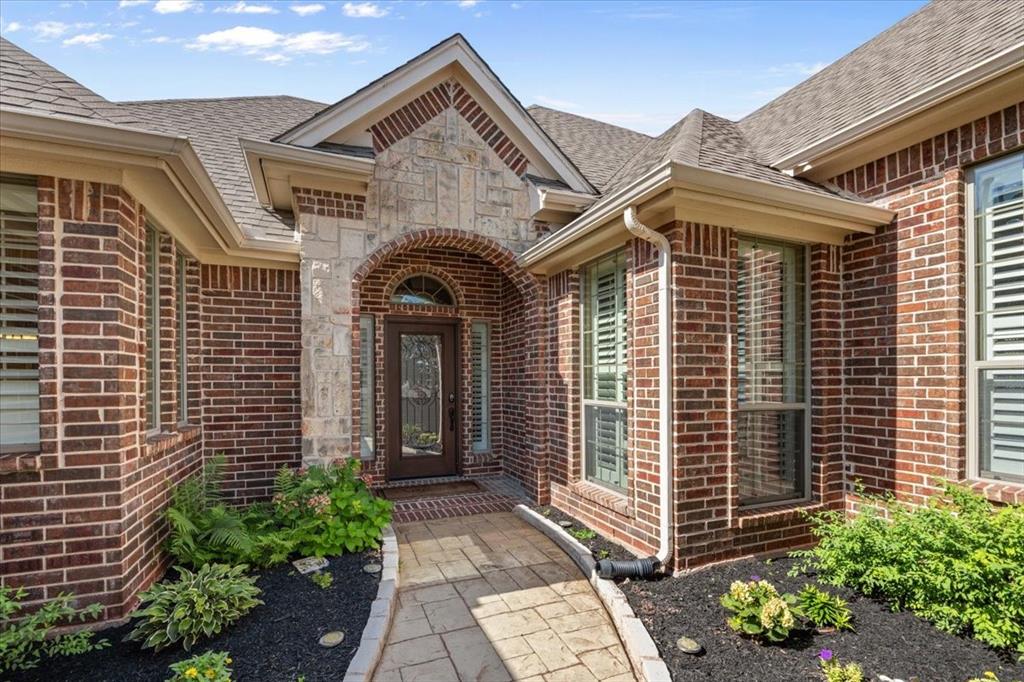 From the charming courtyard entry to the thoughtfully designed floor plan, this garden home offers comfort, elegance, and functionality throughout. The open-concept living, dining, and kitchen area is perfect for entertaining, featuring soaring 11-foot ceilings, a cozy gas fireplace, and timeless plantation shutters that add warmth and sophistication. The spacious, split-bedroom layout offers privacy and versatility, with a generous primary suite on one side of the home and two guest bedrooms—complete with a shared bathroom and their own dedicated living area—on the other. At the heart of the home, the gourmet eat-in kitchen is a chef’s dream, showcasing a large granite island, a cozy breakfast nook, and double ovens, ideal for everything from casual meals to dinner parties. Step outside into your own backyard retreat with a covered patio and built-in outdoor kitchen, perfect for al fresco dining and weekend gatherings. Located just outside of La Cantera with easy access to Highway 820, you’re only 10 minutes from The Shops at Clearfork and 15 minutes from TCU and downtown Fort Worth. This home combines luxurious living with unbeatable convenience—truly a must-see!
