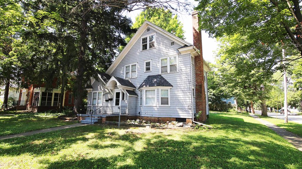 WELOME HOME! This charming Single Family Home (or duplex) in the heart of historic Bellevue is ready for a new owner! Whether you occupy the entire house, live in one unit or rent out both units....there are so many possibilities! This lovely corner lot offers ample parking, one carport and one garage space. This versatile floor plan is sure to please! From the moment you walk in the front entry area, you can access the main level unit or head upstairs to the second floor apartment. You can simply remove the doors in the entryway if you'd like to open up the entire home to occupy. Both units offer entrances from the front or back of the property. The main level features 1-2 bedrooms, a spacious living room w/fireplace, a roomy kitchen, an enclosed back porch and access to the basement!The upstairs offers 3 good sized bedrooms, a large living room w/ fireplace, a bright & airy kitchen and an enclosed back porch. Most of the upstairs also has wood floors! Both floors have their own washer/dryer and ample storage space throughout. With a new roof in 2019, it should be maintenance free for years to come. Don't miss your chance to own a piece of Bellevue's history! This quiet, close-knit community prides itself on it's heritage, with annual events, historic walking tours and a focus on preserving small-town charm! This home is conveniently located near schools, eateries, parks & more. Must see to appreciate! (The main front photo has a tree that's been digitally removed for a better view of the home, there is still a tree in the yard) Listing is also duplicated as a duplex.