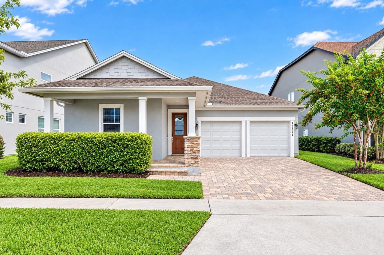 Every single day, you’ll experience the ultimate Central Florida lifestyle in your own private backyard paradise. Tucked into the coveted Latham Park community of Winter Garden, just two miles from Disney’s Magic Kingdom, this pristine 2018-built home pairs luxurious outdoor living with unbeatable convenience to world-class entertainment, shopping, and dining. Surrounded by updated curb appeal, mature landscaping, and a quiet neighborhood setting, it offers a rare combination of comfort, style, and resort-style amenities right at home.Inside, the light-filled floor plan feels crisp, elevated, and completely turn-key, highlighted by elegant crown molding and durable wood-look tile floors running throughout the main living areas. High tray ceilings accentuate the main open-concept living and dining spaces, leading seamlessly into a dedicated flex space. Showcasing true Florida indoor-outdoor living, the home features both a standard sliding door and a triple sliding glass door that opens directly from the flex space out to the pool area.At the center of it all is a modern chef’s kitchen designed for both quiet mornings and hosting friends. It boasts 42-inch cabinets, sleek quartz countertops, under-cabinet accent lighting, a gas range, and premium stainless steel appliances. Conveniently nearby, an oversized laundry room comes fully equipped with a washer and dryer while providing exceptional extra storage space. For total peace of mind and remarkable efficiency, the home is secured with a SimpliSafe security system, equipped with a tankless water heater, and features fully paid-off solar panels for ultra-low electricity bills.The primary suite serves as your private sanctuary, featuring a custom built-in walk-in closet system and a beautifully appointed primary bathroom complete with a luxurious, walk-in shower. Two additional spacious bedrooms with luxury vinyl flooring provide exceptional flexibility for family, guests, or a dedicated home office setup.Step out back into your personal outdoor oasis—a custom screen-enclosed pool deck featuring a stunning heated saltwater pool and spa, built-in controllable LED lighting overhead and within the enclosure, and a Char-Broil outdoor kitchen perfect for weekend barbecues. The fully fenced backyard ensures a private, safe space for relaxation or outdoor fun. Beyond your doorstep, enjoy Latham Park’s vibrant community events, pool, playground, and spectacular views of the Disney fireworks right from within the neighborhood—plus access to top-tier schools including Panther Lake Elementary, Hamlin Middle, Horizon High, and Windermere Prep. From private poolside relaxation to nightly magic nearby, this is a rare gem in one of Winter Garden’s most sought-after pockets.