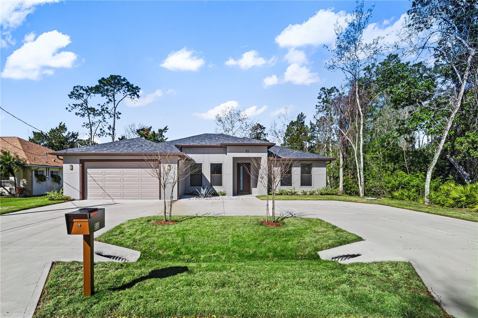 New Construction Custom House !!! Welcome to your dream home at 11 Ethan Allen Drive, where modern elegance meets practical design. This custom-built house offers a seamless blend of contemporary style and functional living spaces, perfect for a family seeking comfort and sophistication. Features: -2 Master Bedrooms is a private retreat, featuring spacious layouts, walk-in closets, and stylish en-suite bathrooms with walk-in shower and a sleek glass enclosure -2 additional Bedrooms offers comfort and versatility for family or guests -Third Bathroom in addition to the en-suite master bathrooms, there is a convenient guest bathroom designed with modern fixtures and finishes -2 Car Garage: The garage is equipped with a smart app-controlled door opener and an epoxy-coated floor, offering both convenience and durability. Total Under Roof: 3,547 sq ft** - **Living Area: 2,548 sq ft** - **Garage: 537 sq ft** - **Front Entry: 61 sq ft** - **Lanai: 401 sq ft** -Open Concept Living: The floor plan features soaring vaulted ceilings, modern trim and baseboards, and elegant light fixtures. The living, dining, and kitchen areas flow seamlessly together, creating an ideal space for both relaxation and entertaining. -Kitchen: At the heart of the home is a beautiful kitchen complete with a large customized quartz island and high-end stainless steel appliances. Additional Features: 8’ doors throughout the home. 9’-4” ceilings in all bedrooms and living area Smart energy-efficient AC units and double-pane windows and sliding doors. Bathrooms feature floating vanities with beautiful bronze Delta fixtures. Remote-controlled ceiling fans and all LED light fixtures, including well-positioned recessed lights. Covered patio with a summer kitchen for outdoor enjoyment. This home is located in Palm Coast, a highly sought-after area known for its convenient access to St. Augustine and Daytona Beach. You’ll be close to shopping centers, Town Center, restaurants, parks, and healthcare facilities. With easy access to US-1 and I-95, and just a 15-minute drive to Flagler Beach, you’ll enjoy the best of Florida living. The area is ideal for outdoor enthusiasts, offering year-round activities like canoeing, kayaking, boating, bicycling, and golf. Don’t miss the opportunity to make this exquisite home yours. Contact me today for more information and to schedule a private tour.