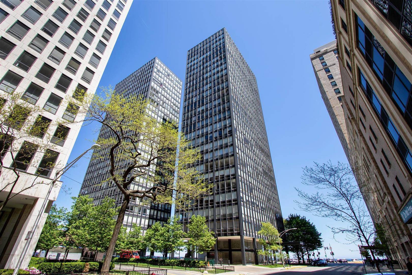Breathtaking views of Lake Michigan! Enjoy spectacular sunrises on the lake in this landmark Mies Van Der Rohe building on Lake Shore Drive. This bright and  spacious 3 bedroom 2 bath open concept unit features custom kitchen cabinets with black granite breakfast bar, stainless steel appliances, and wine rack. Also has crown molding and marble floors throughout.  The floor to ceiling windows showcase the Navy Pier fireworks and the Air Show. The recessed lighting, curio shelf and modern chandelier are special touches.  Central air and all window treatments included.  The primary bedroom suite includes private bath with steam shower, display shelving, walk in closet, French doors and adjoining sitting room. Jacuzzi bathtub in second bath. Plenty of closets. Two closets in 3rd bedroom.  Enjoy dining with unobstructed views of the lake. Full amenity coop building with 24hr door staff, on-site management office, 24 hour engineering and maintenance staff, 2 exercise rooms, hospitality and meeting room, generous storage locker, bicycle storage rooms, beautiful plaza.  Premier personal parking space included. Wonderful lifestyle near world class restaurants, designer shopping, Northernwestern University medical campus, Museum of Contemporary Art, and beaches. Designated Managing Broker Owned. Second parking space available.